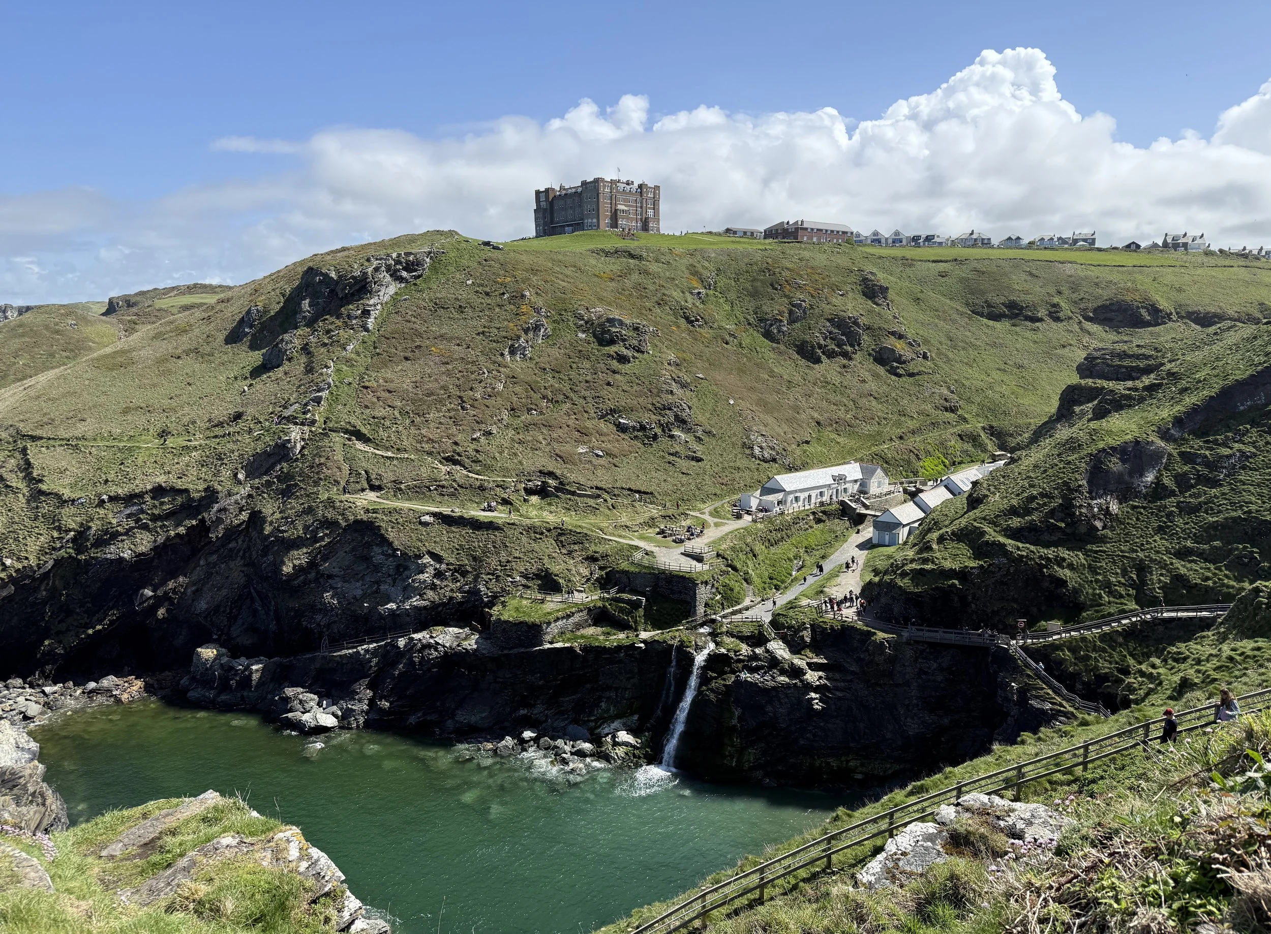 A beautiful photo of the castle ruins and a waterfall. This photo captures the history and natural beauty of the area.