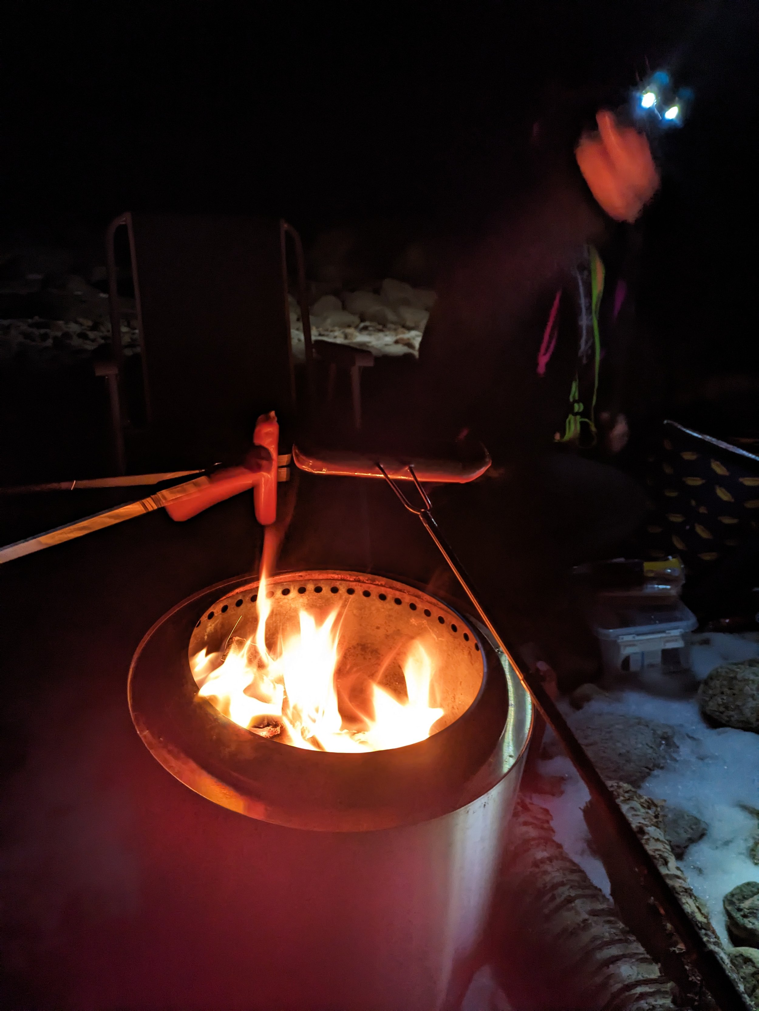 Fueling up with a bonfire and hot dogs in the Arctic. A perfect way to stay warm and get ready for a long night.