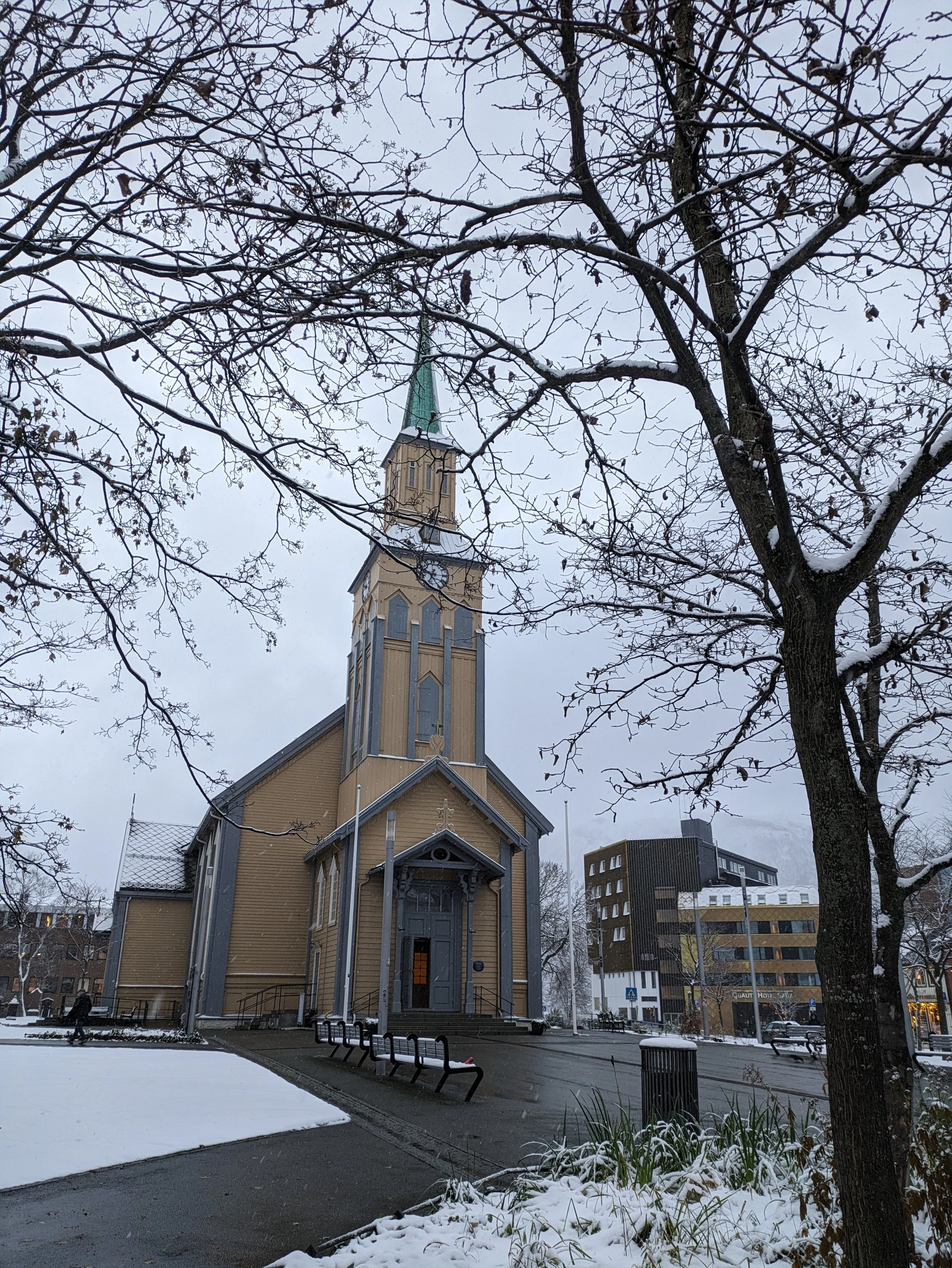     A beautiful church in the snow. This photo captures the cozy, winter charm of the city of Tromsø, Norway.  Tromsø City View: