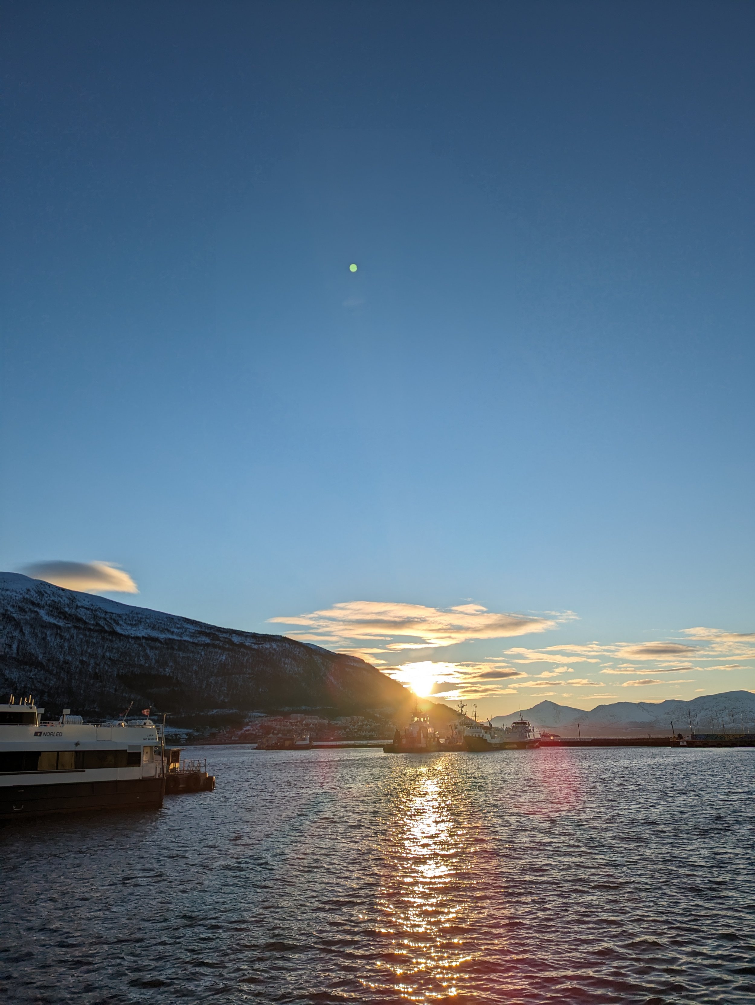 The sun setting over the water in Tromsø. A beautiful and peaceful moment of reflection and a perfect end to a day of exploration.