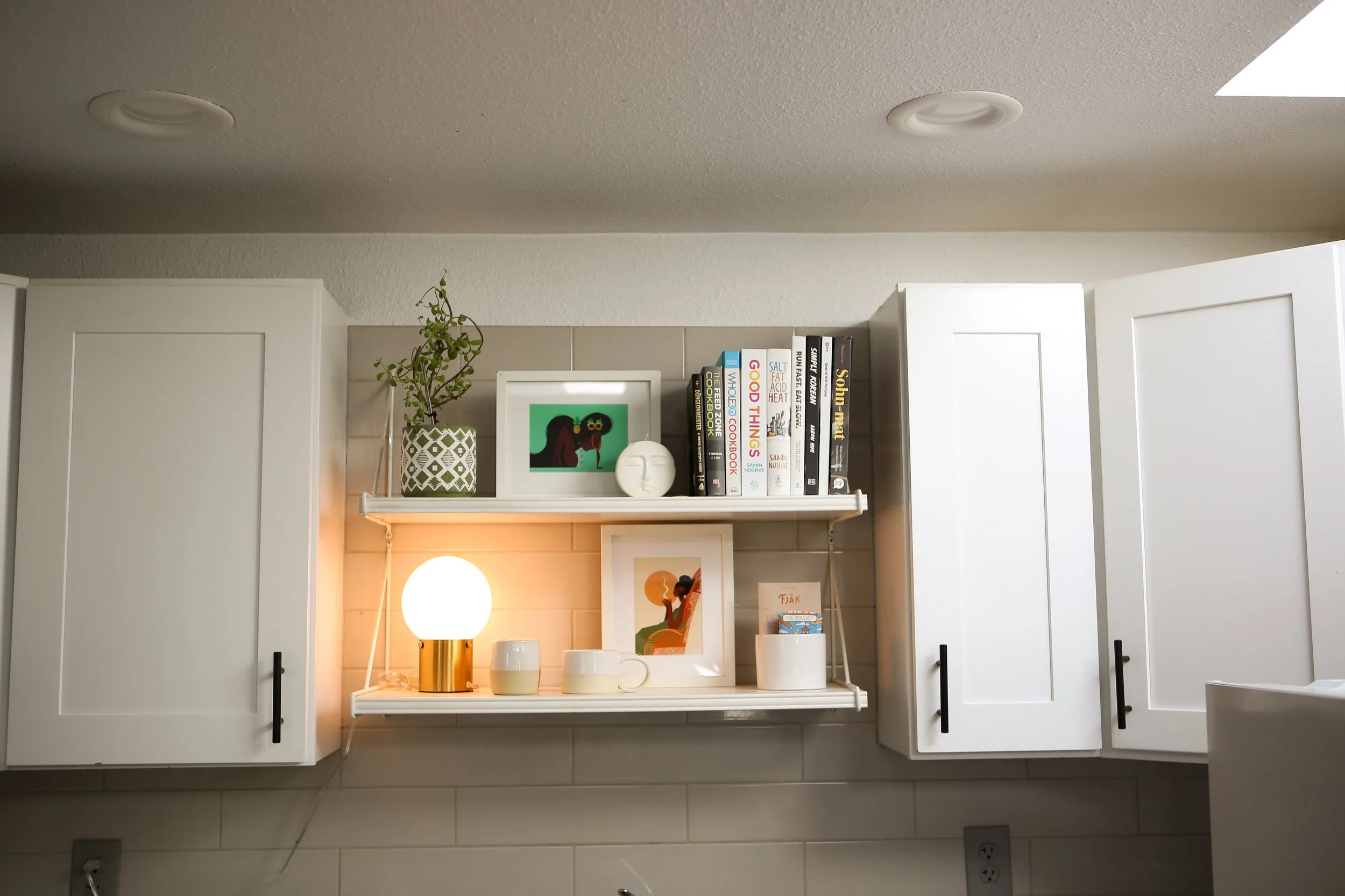 Cabinet and floating shelf installation.