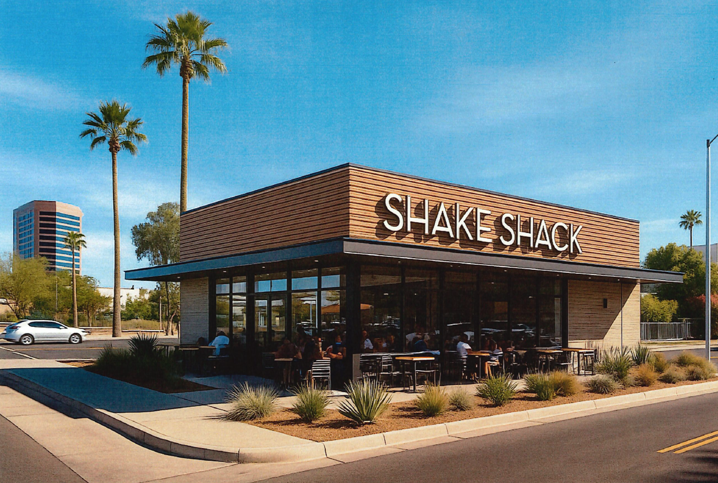 Shake Shack restaurant exterior with outdoor seating on a sunny day, tall palm trees, and a clear blue sky.