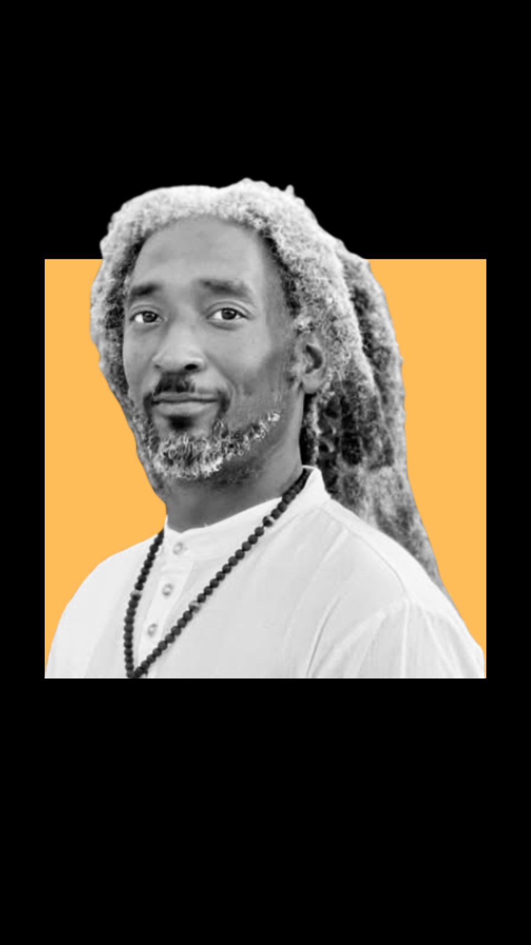 A black-and-white photo of a man with long, gray dreadlocks, wearing a white shirt and beaded necklace, against an orange rectangle background with a black backdrop.