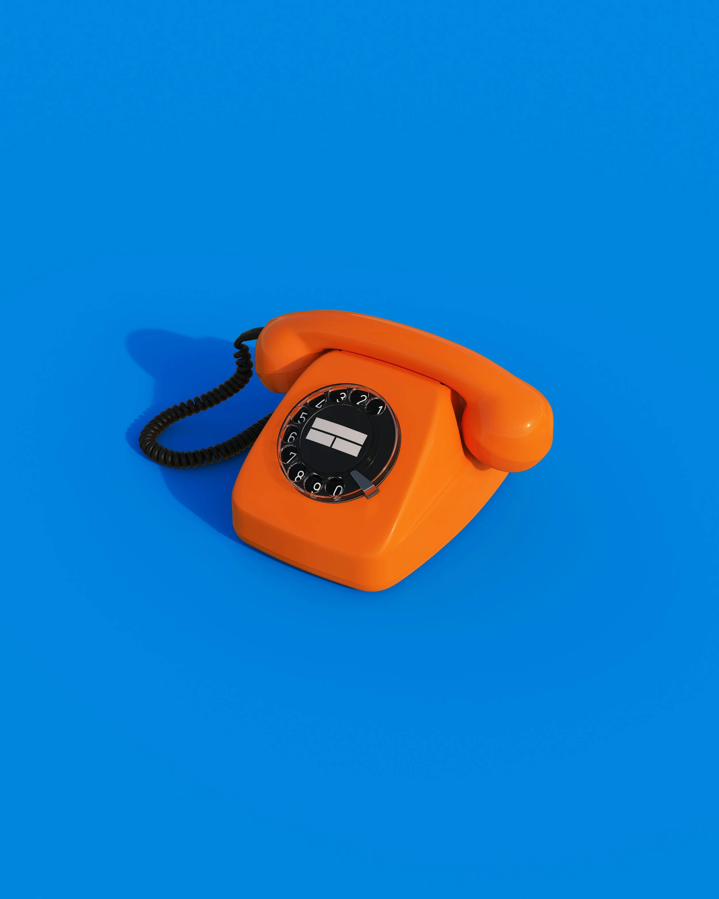 An orange rotary dial telephone with a black cord on a bright blue background.