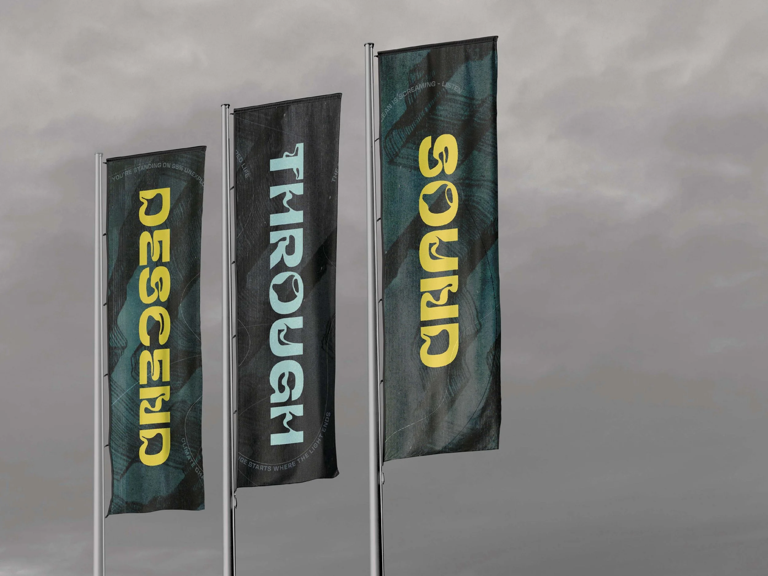 Three flags with the text 'DESIGNED,' 'TRIANGLE,' and 'CIRCULAR' on grey clouds.