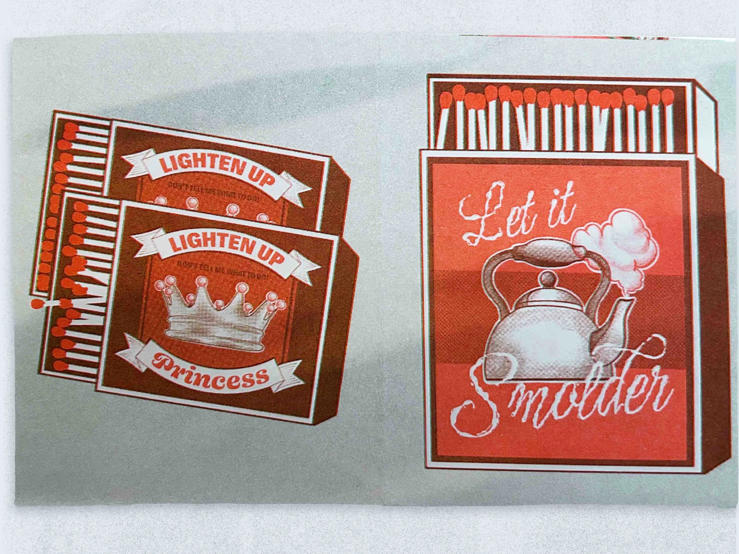Two matchbooks with red and white designs displaying the phrases 'Lighten Up Princess' and 'Let it Stewder,' respectively, with one featuring a crown and the other a teapot illustration.