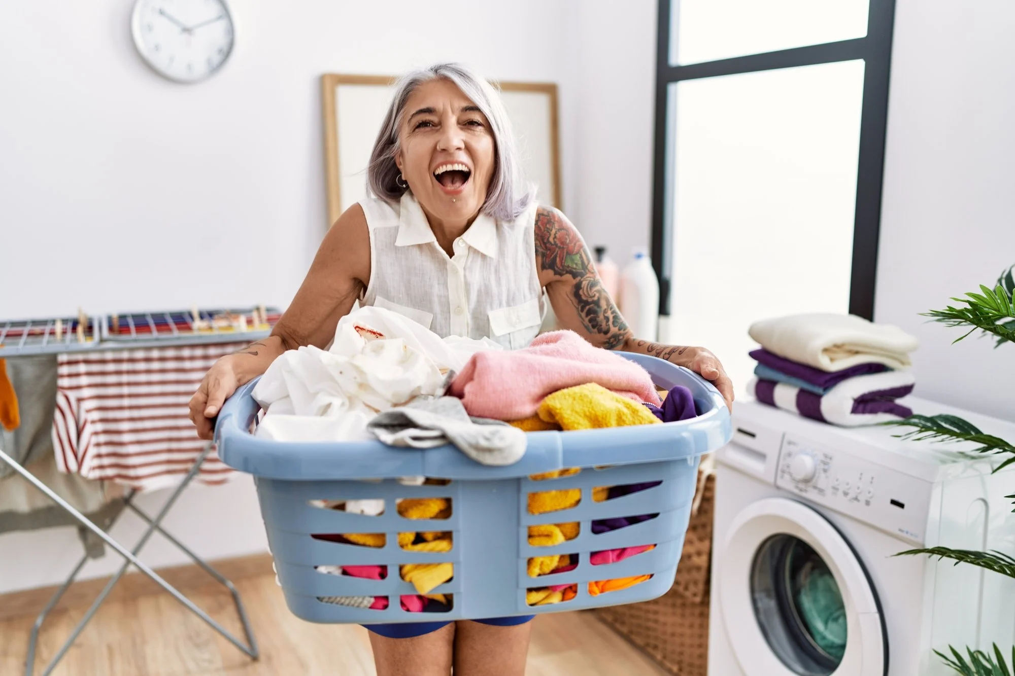 woman with grey hair doing laundry