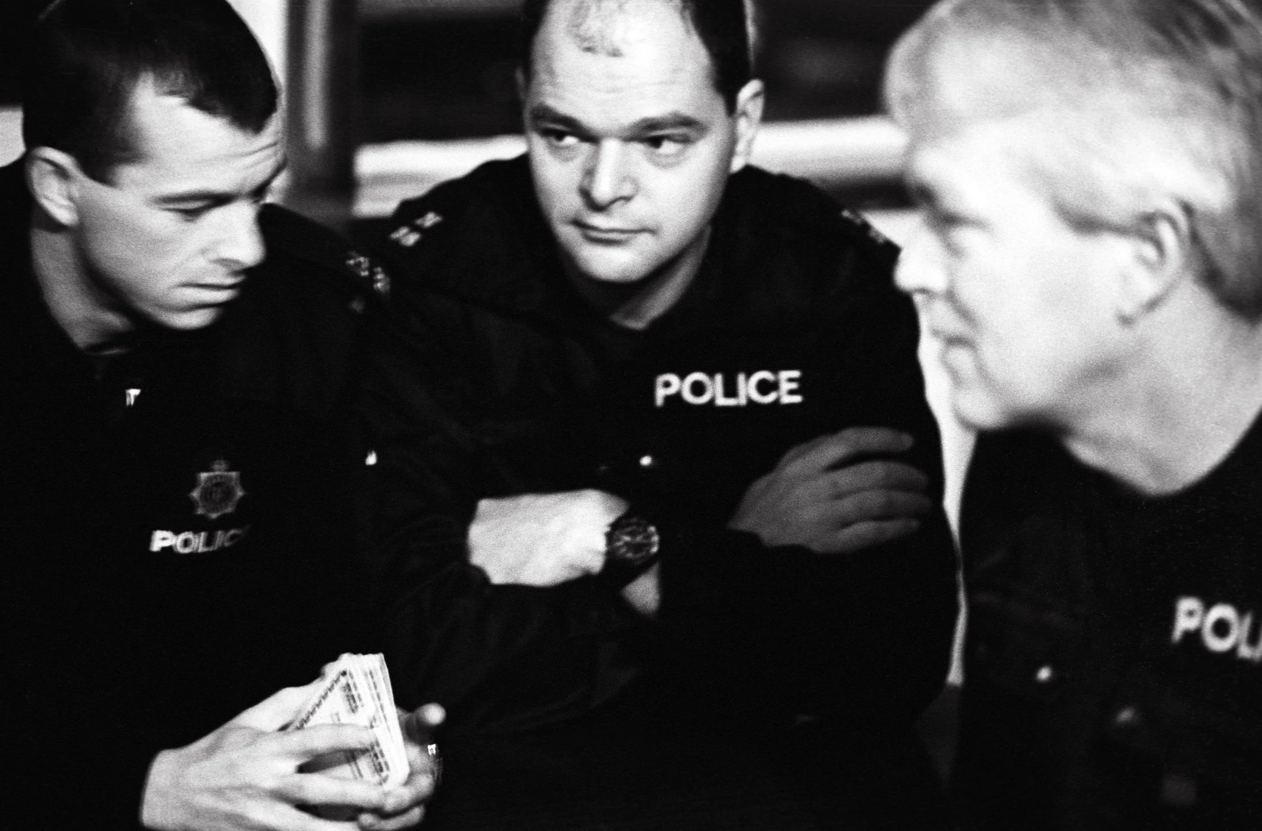 AT SIX AM ON A DARK DECEMBER MORNING, OFFICERS AWAIT THE GREEN LIGHT TO MAKE MUNLEY’S ARREST MUNLEY IS TAKEN TO CRAWLEY POLICE STATION. DI SIMMONDS' TEAM THEN SEARCHED MUNLEY'S FLAT, AND STRUCK GOLD. WHILE MUNLEY WAS BEING QUESTIONED,