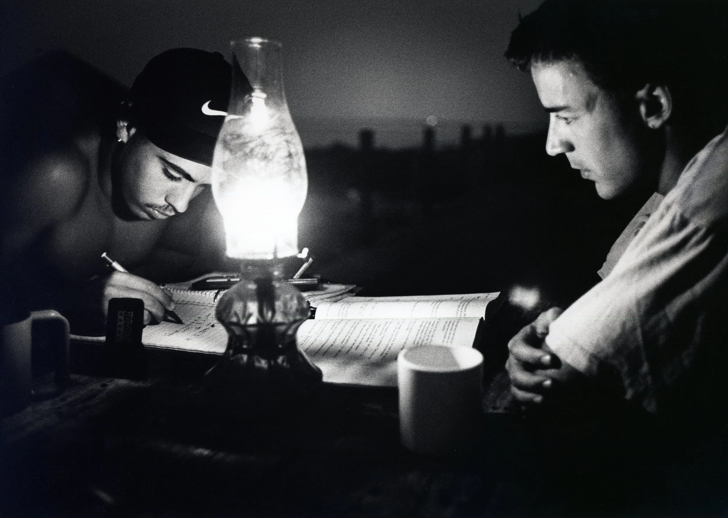 IN THE CALM OF A SUMMER NIGHT ON THE TERRACE, TEACHER SHAWN OFFERS SCOTT HELP WITH HIS MATHS HOMEWORK.&nbsp; STAFF WERE ESSENTIALLY ON DUTY TWENTY-FOUR HOURS A DAY 
