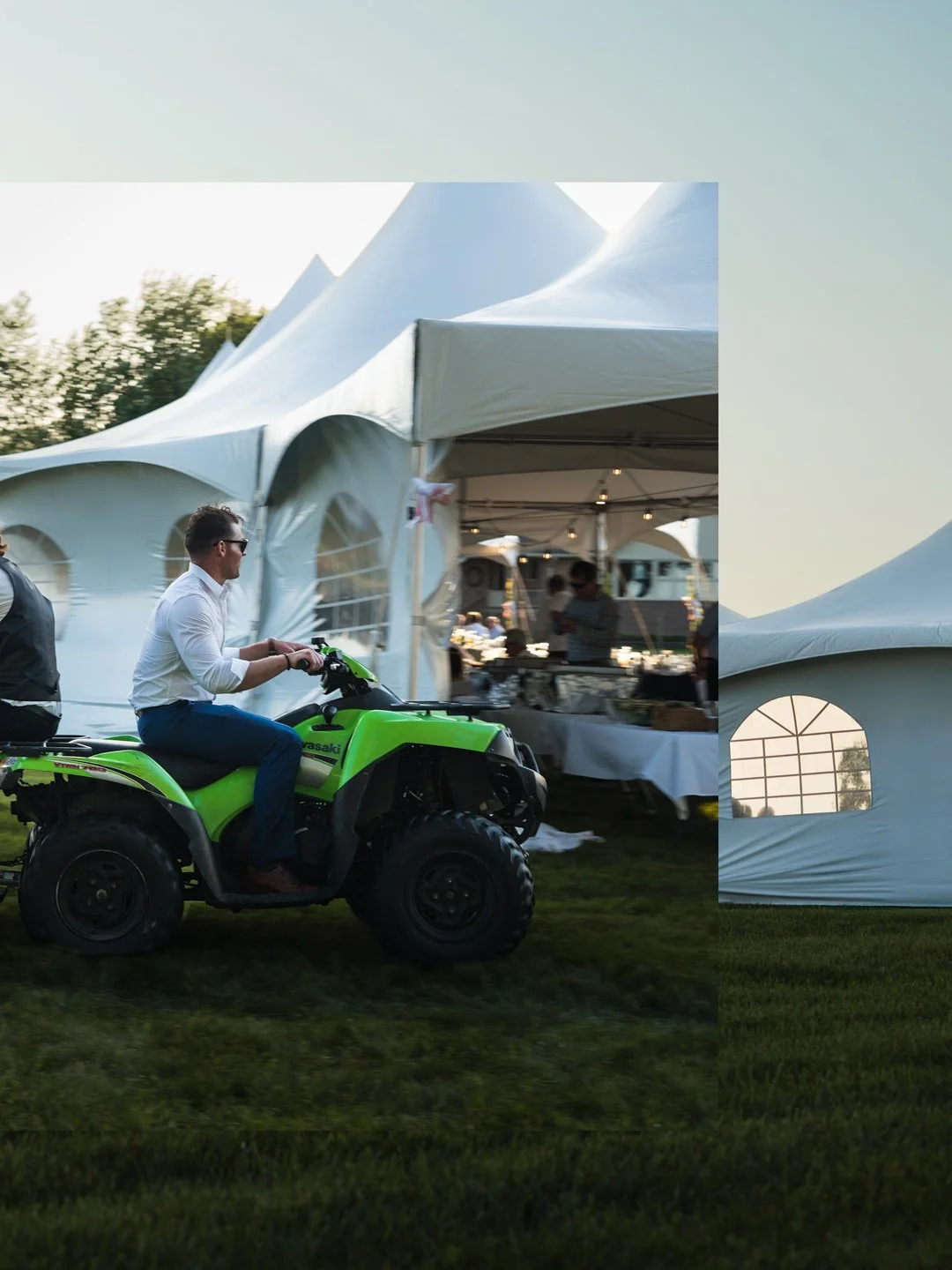Man riding a green Kawasaki all-terrain vehicle near white event tents at an outdoor gathering in the late afternoon.