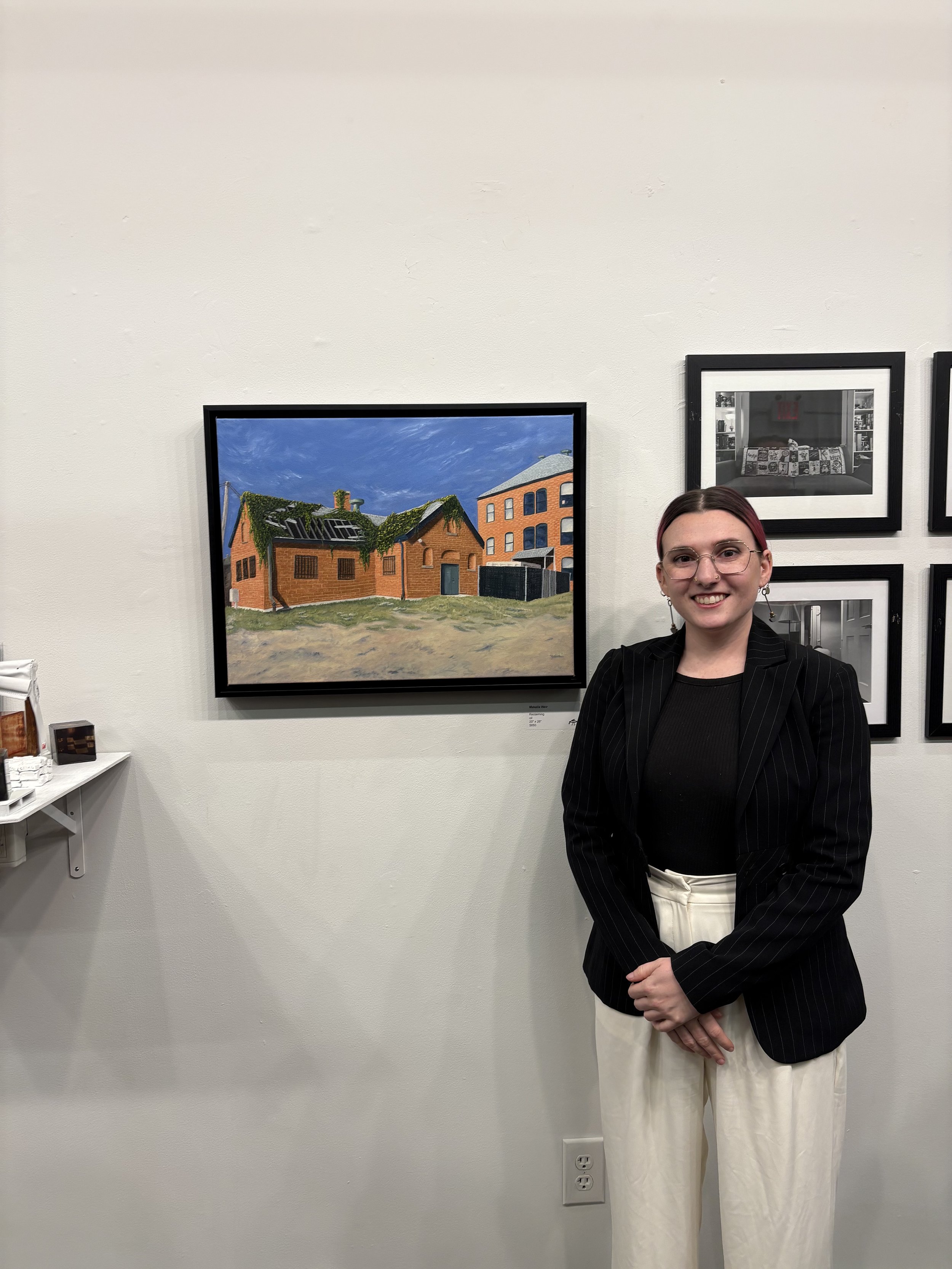 Makaila Weir and their art at the Community Art's Incubator 2025 Mentee Showcase