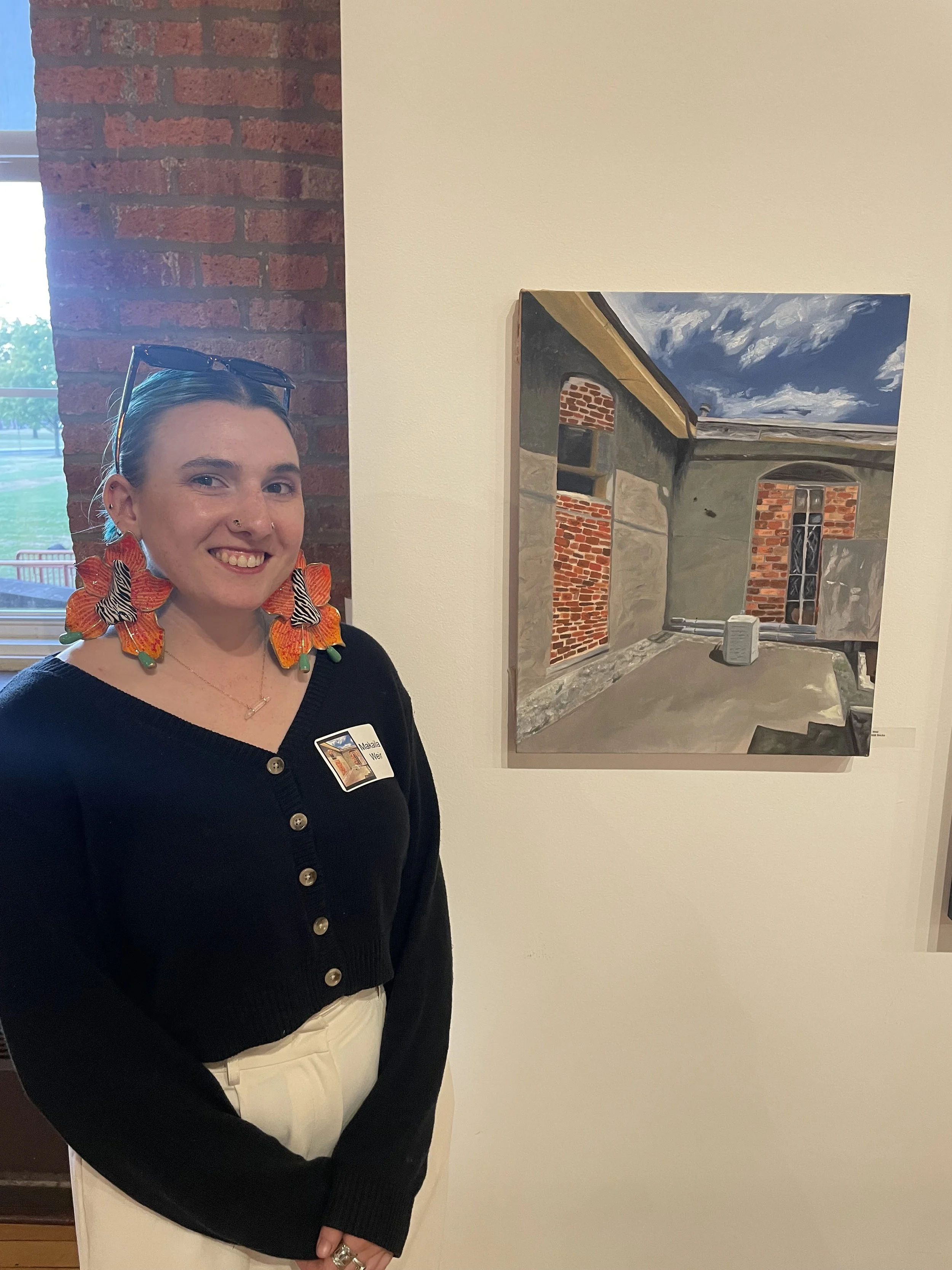 Makaila Weir and their art at the Ohio Art League Fall Juried Exhibit
