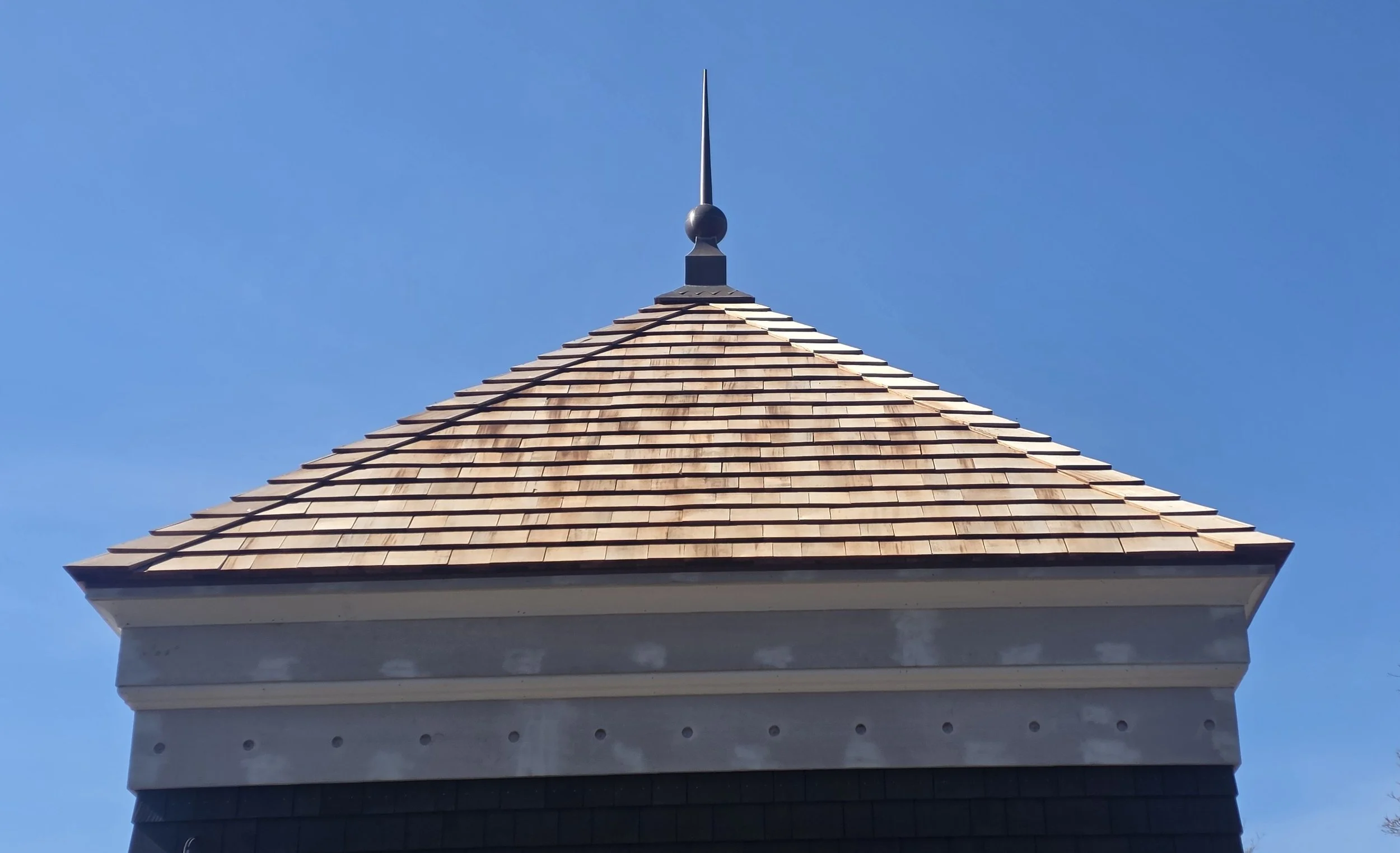 Copper finial on a wood roof by Custom Copper Co. in Newport, Rhode Island