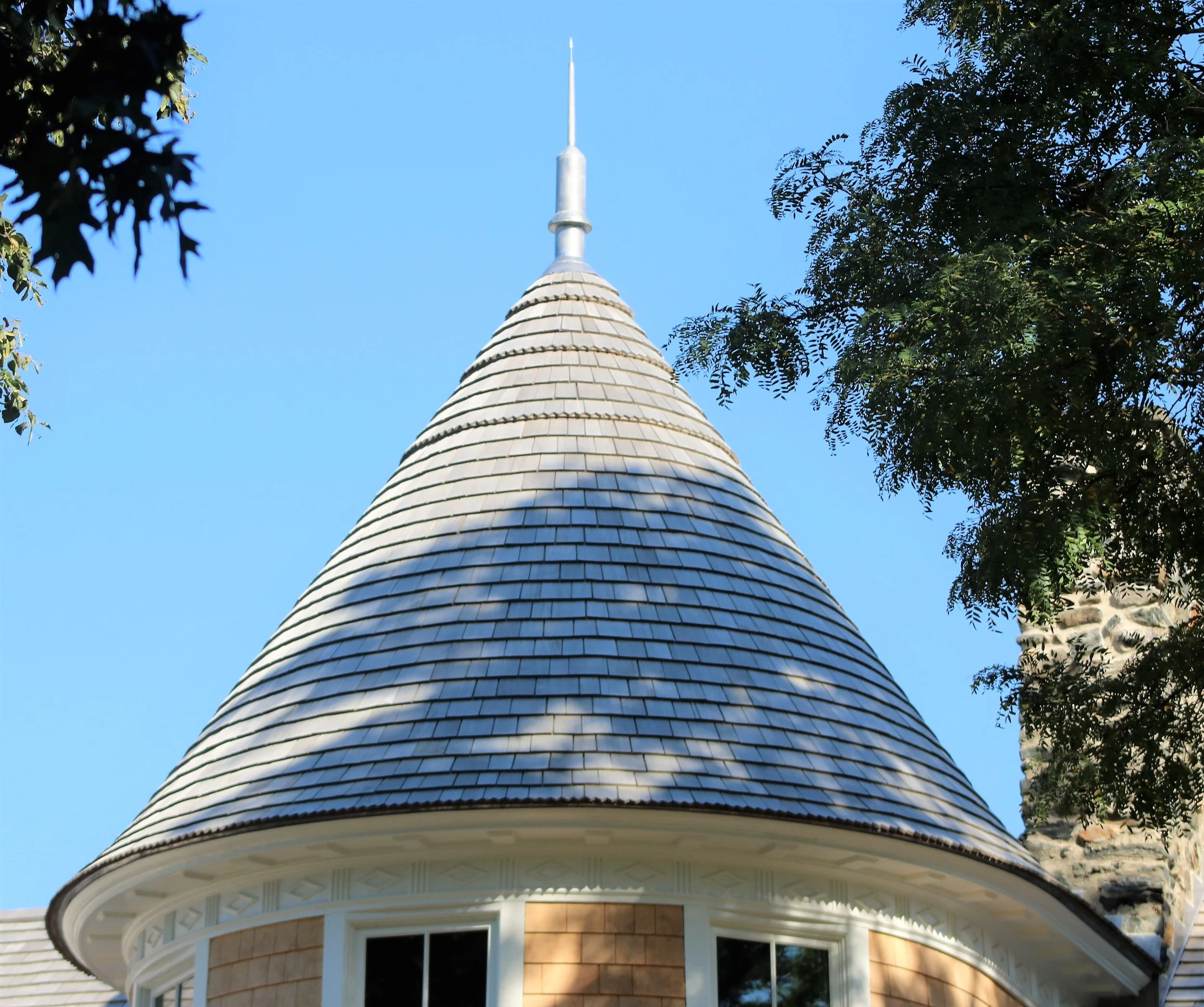 Custom copper finial on a historic property with cedar wood roof by Custom Copper Co. in Newport, Rhode Island