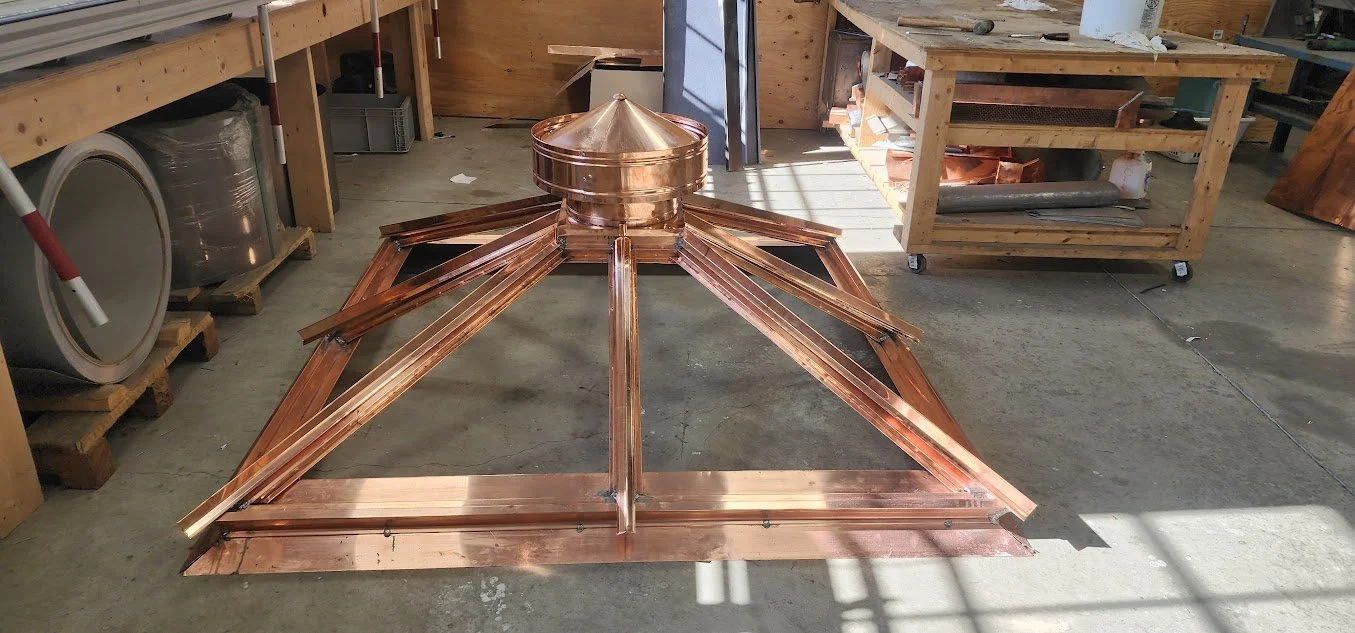 Precision craftsmanship went into this metal skylight pre-installation by Custom Copper Co., in Newport, Rhode Island.