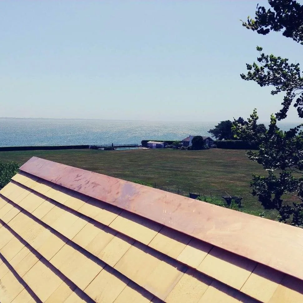 Metal ridge detail on a cedar wood roof by Custom Copper Co., in Newport, Rhode Island.