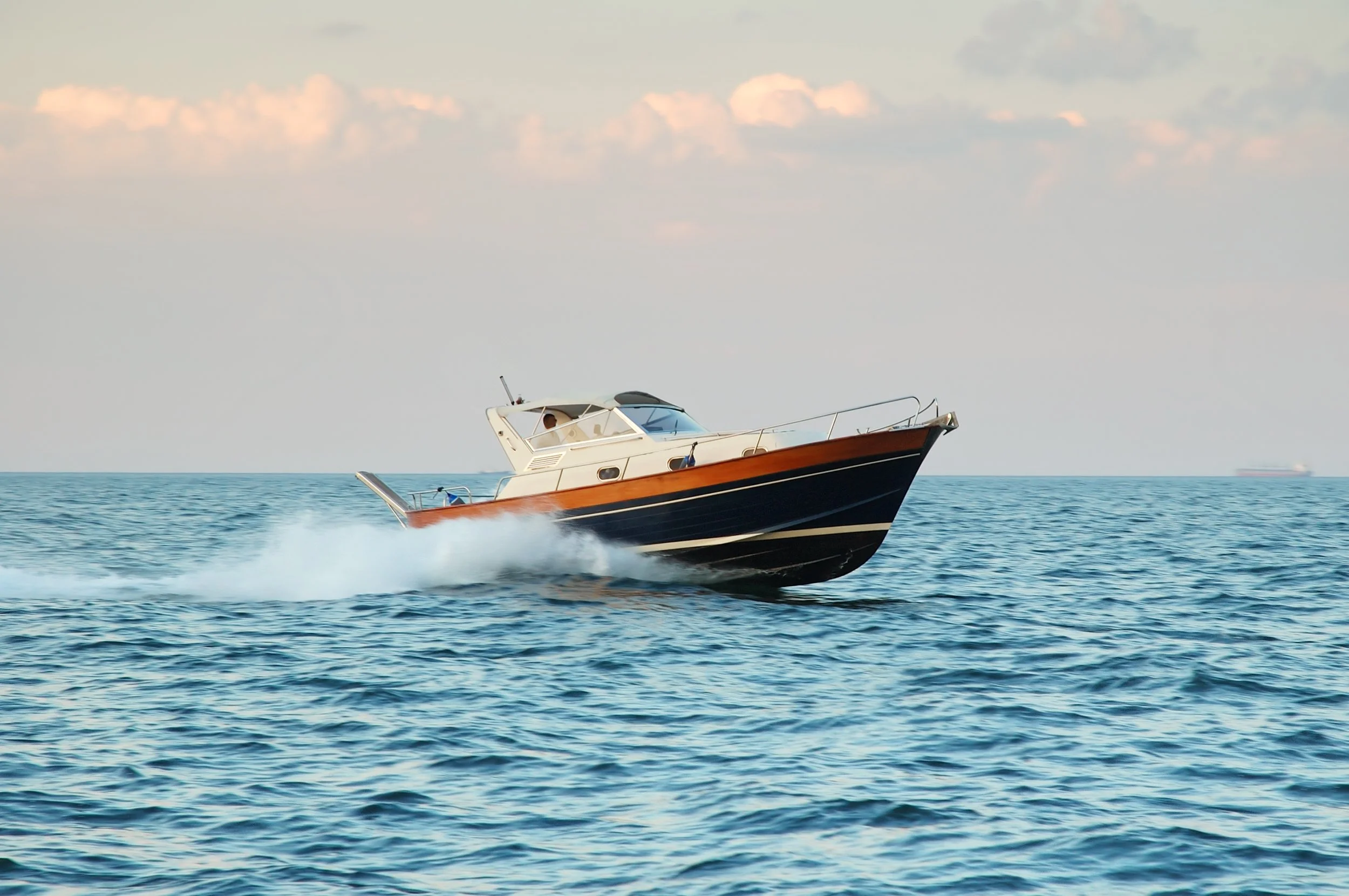 classic-motorboat-speeding-across-the-open-blue-oc-2026-03-19-23-03-55-utc.jpg