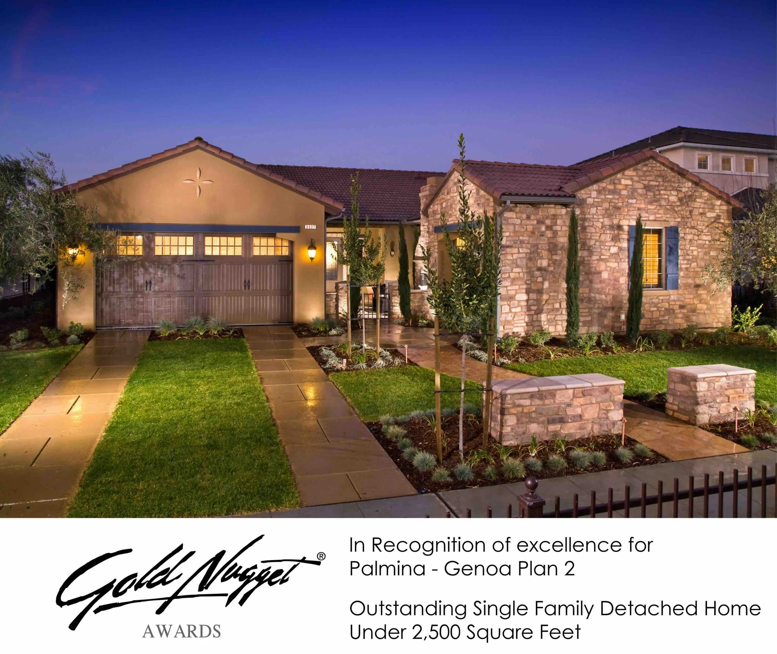 Front view of a single-family detached home with a brick and stucco exterior, a two-car garage, landscaped lawn, and pathway leading to the entrance, taken during dusk.