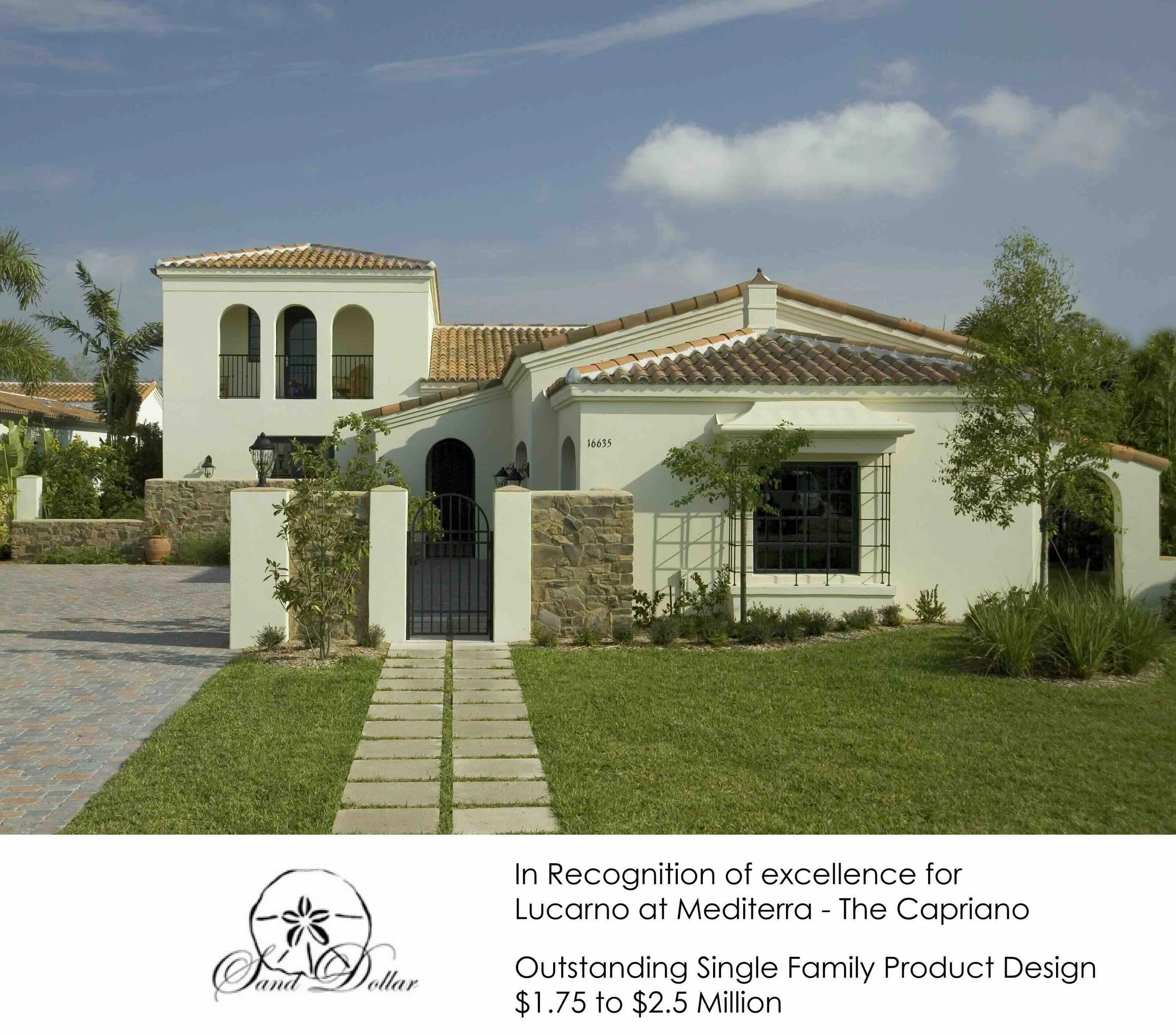 A Mediterranean-style house with a stone and white stucco exterior, red-tiled roof, front yard with grass, small trees, and a stone pathway leading to a black gate.