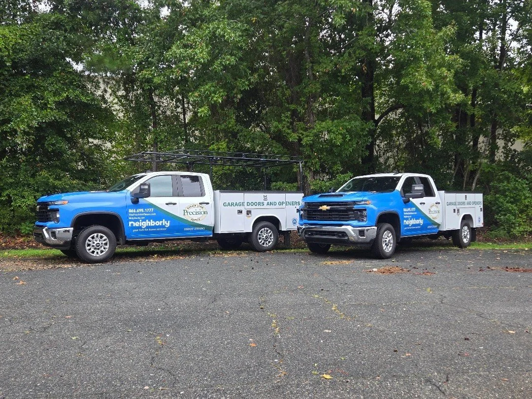 Two matching commercial service trucks with fleet graphics by TGD wraps, Chesapeake VA