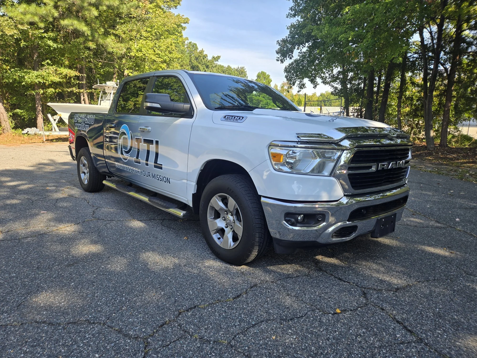 Ram 1500 work truck with partial wrap and company logo by TGD wraps, Chesapeake VA