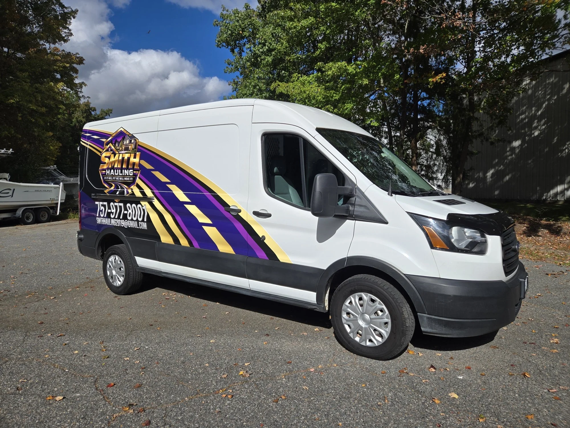 Ford Transit cargo van with a custom partial wrap by TGD wraps in Chesapeake, VA