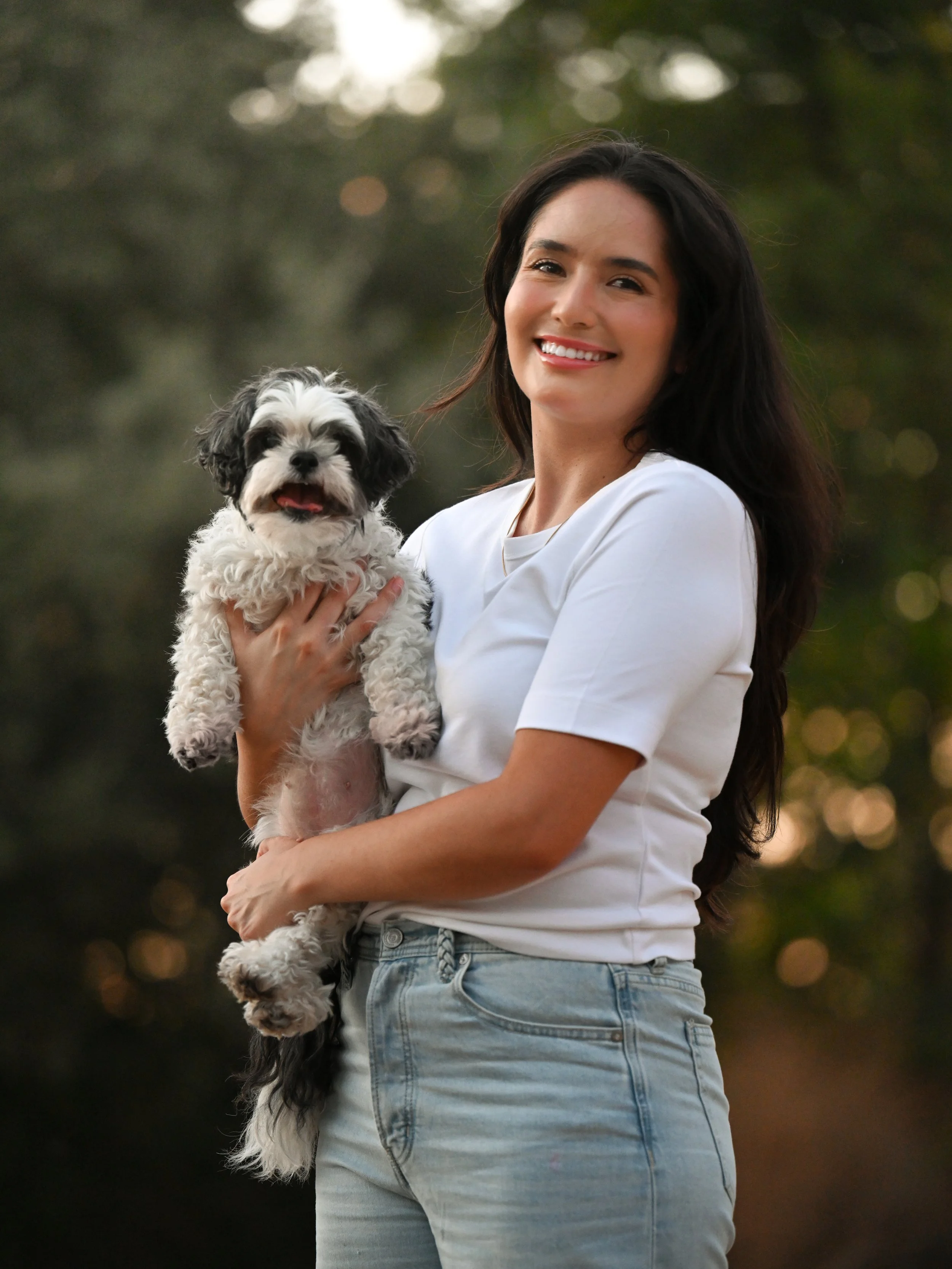 Sean' customers, Katrina and Chiquita embracing in a park