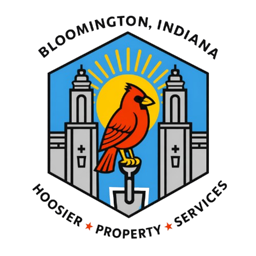 Cardinal standing on a shovel between the Sample Gates with the sun in the background. The words Hoosier Property Services surrounds a hexagon logo.