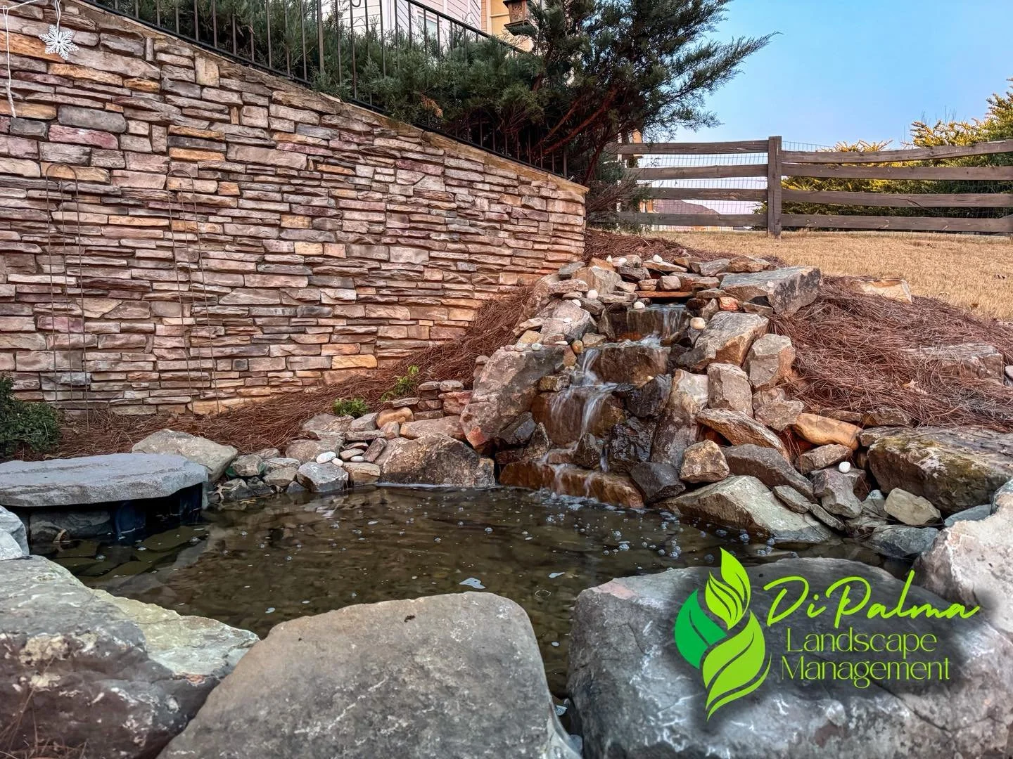 ✨Add life to your backyard space with a custom water feature 🐠. 

We added this small pond and waterfall to an empty corner of the yard to give our client a peaceful place to relax. This feature will be getting a full set of greenery and plantings ?