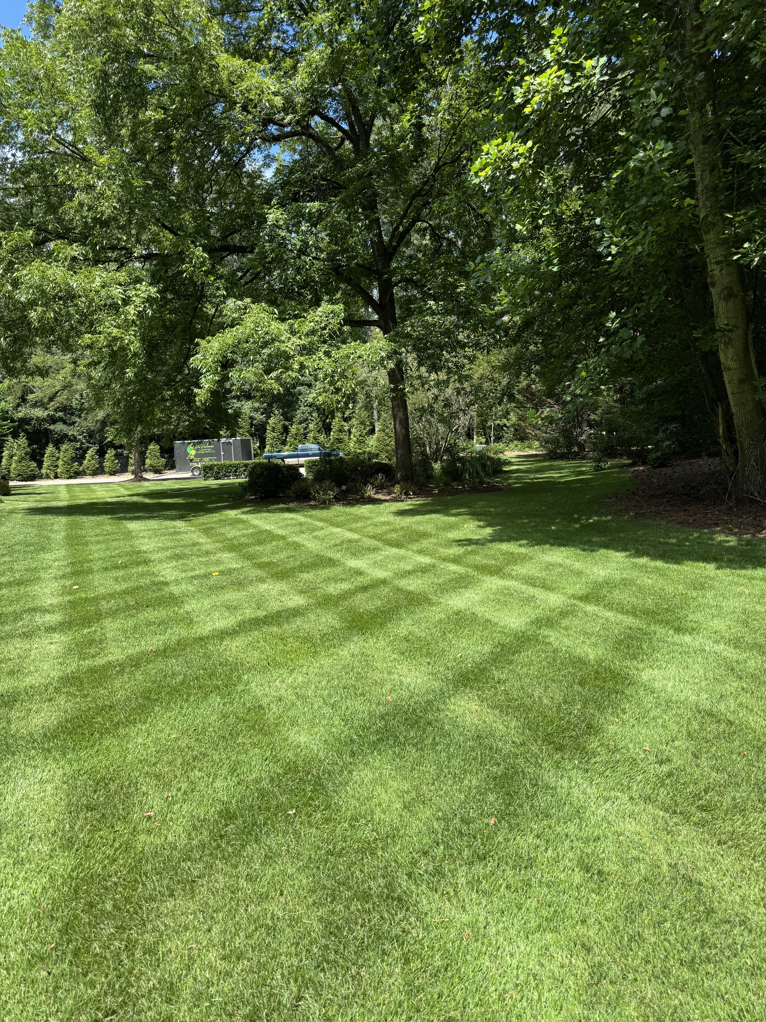Lawn mowing and maintenance service at a residential house in Marietta, GA.