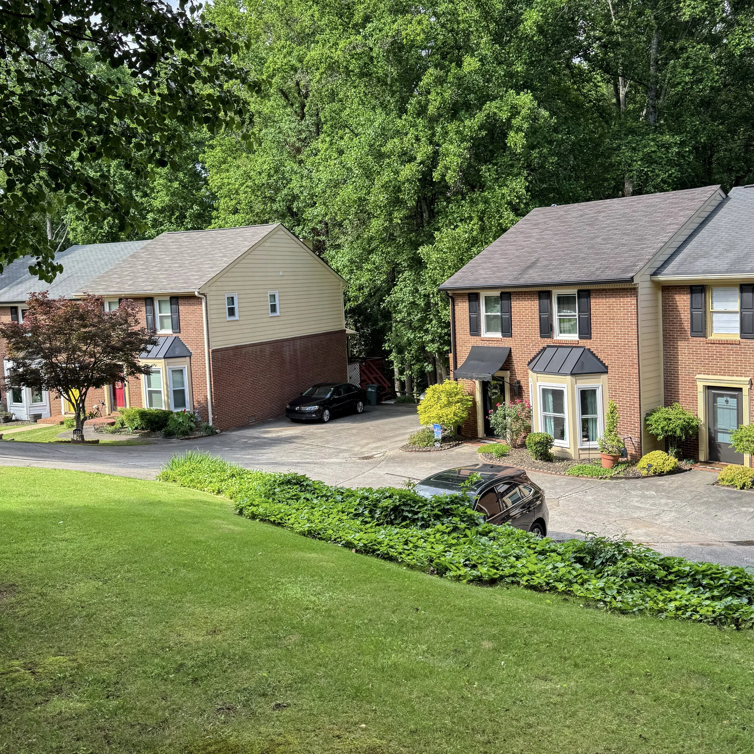 Professional landscape maintenance for a townhome community with neatly maintained lawns and common areas in Marietta, GA