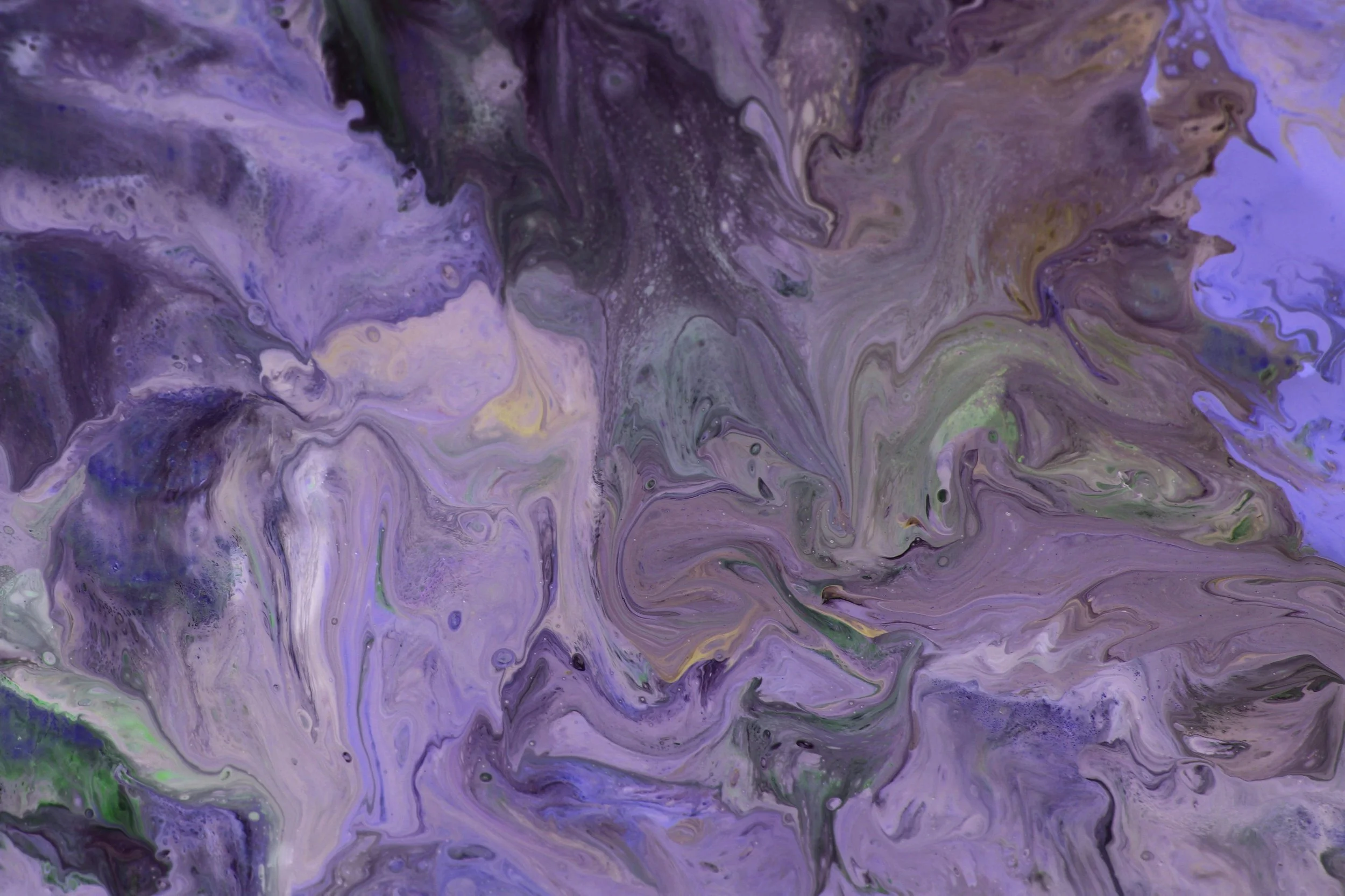 Abstract swirl of purple, black, lavender, green, and hints of yellow with a marbled texture.