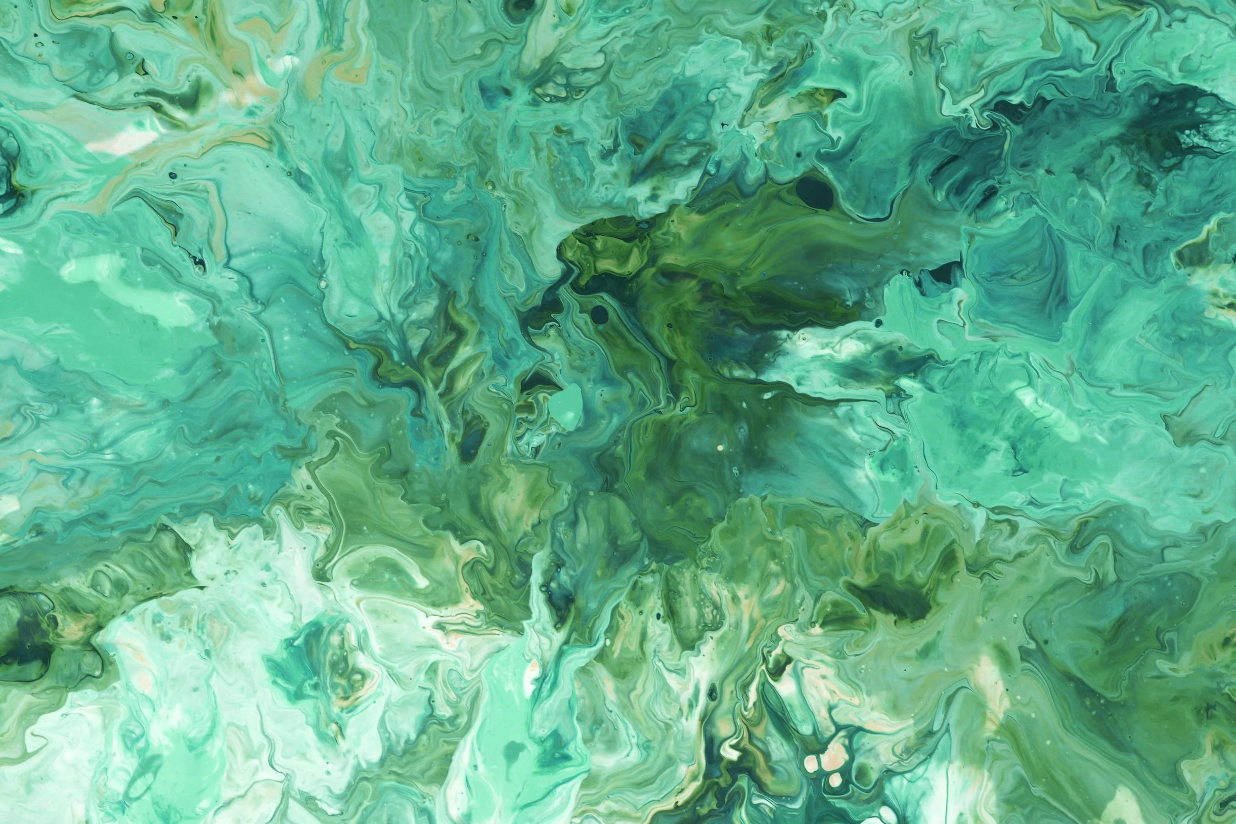 Abstract green marbled pattern with swirls of light and dark green, black, and white hues.