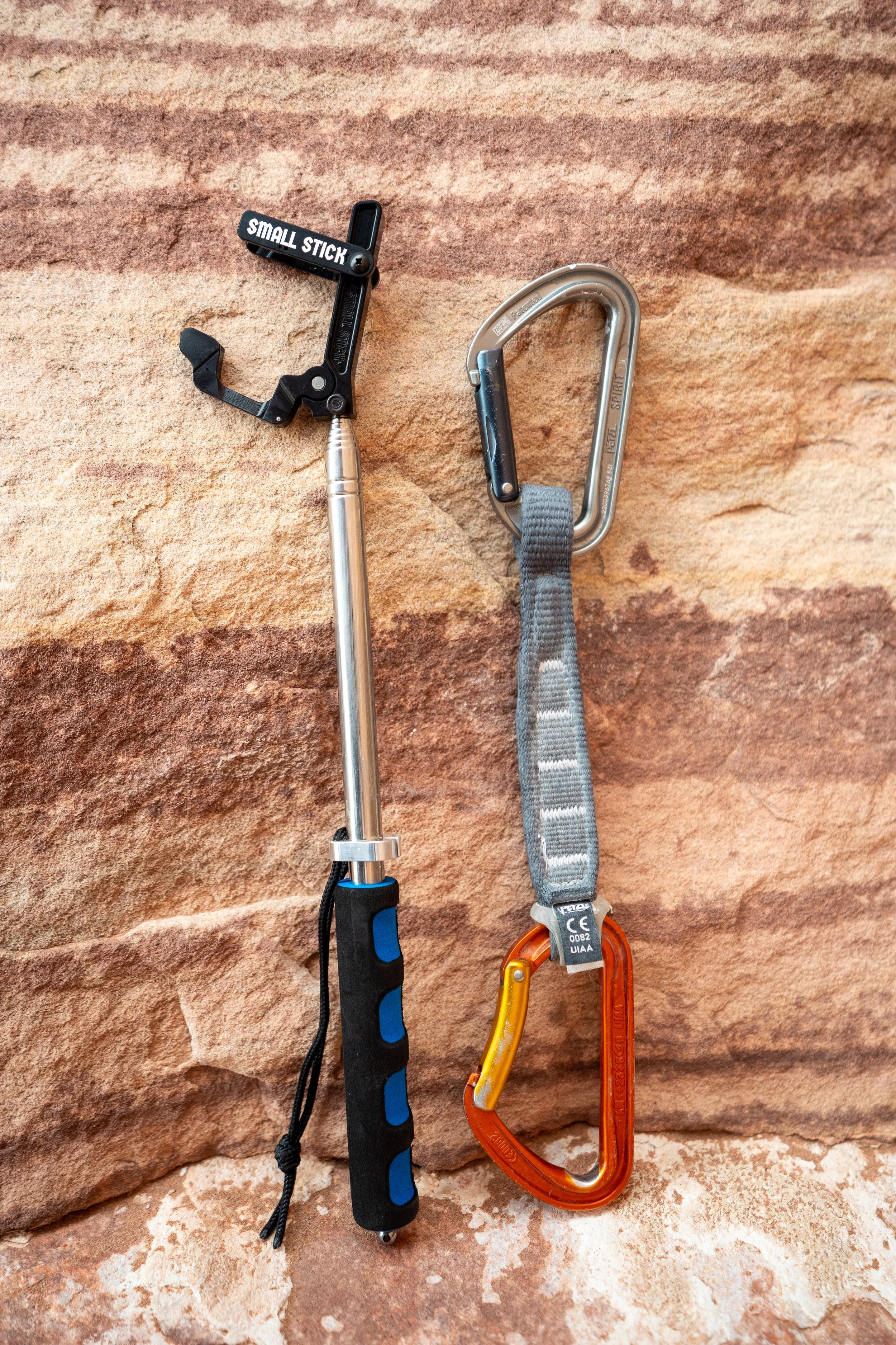 Small Stick open and quickdraw leaning on rock.jpeg