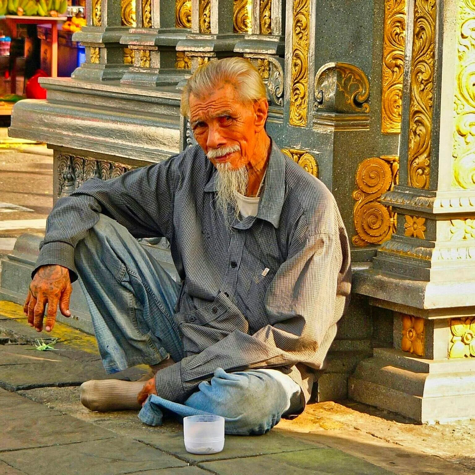 Making merit is part of daily life in Bangkok - You'll find quiet residents accepting donations near temples & markets