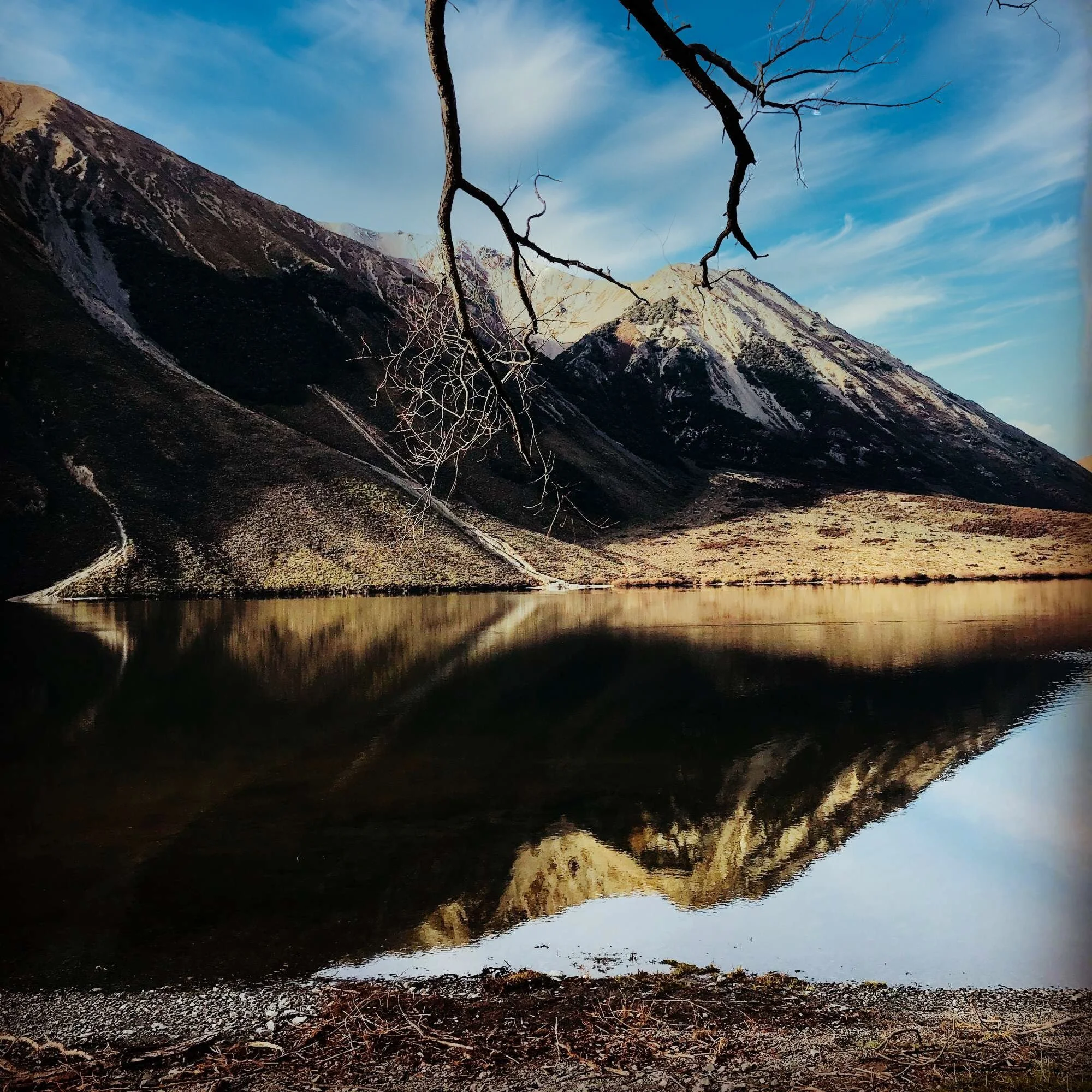 Discover nature's tranquility in New Zealand's South Island - A breathtaking scene where mountains meet mirror-like reflections