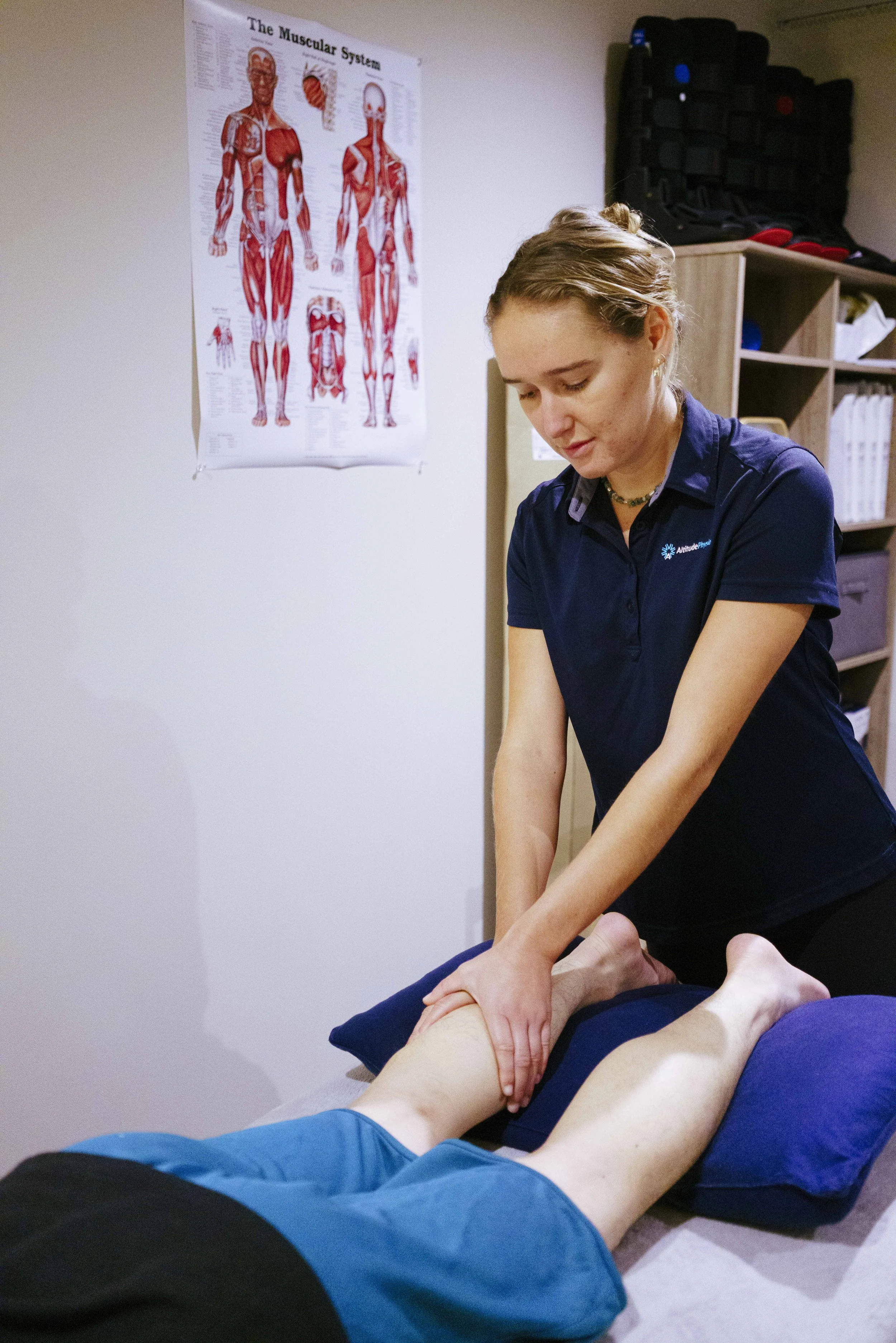 Physiotherapist at Peak Sports Physio Hakuba treating an injured calf muscle