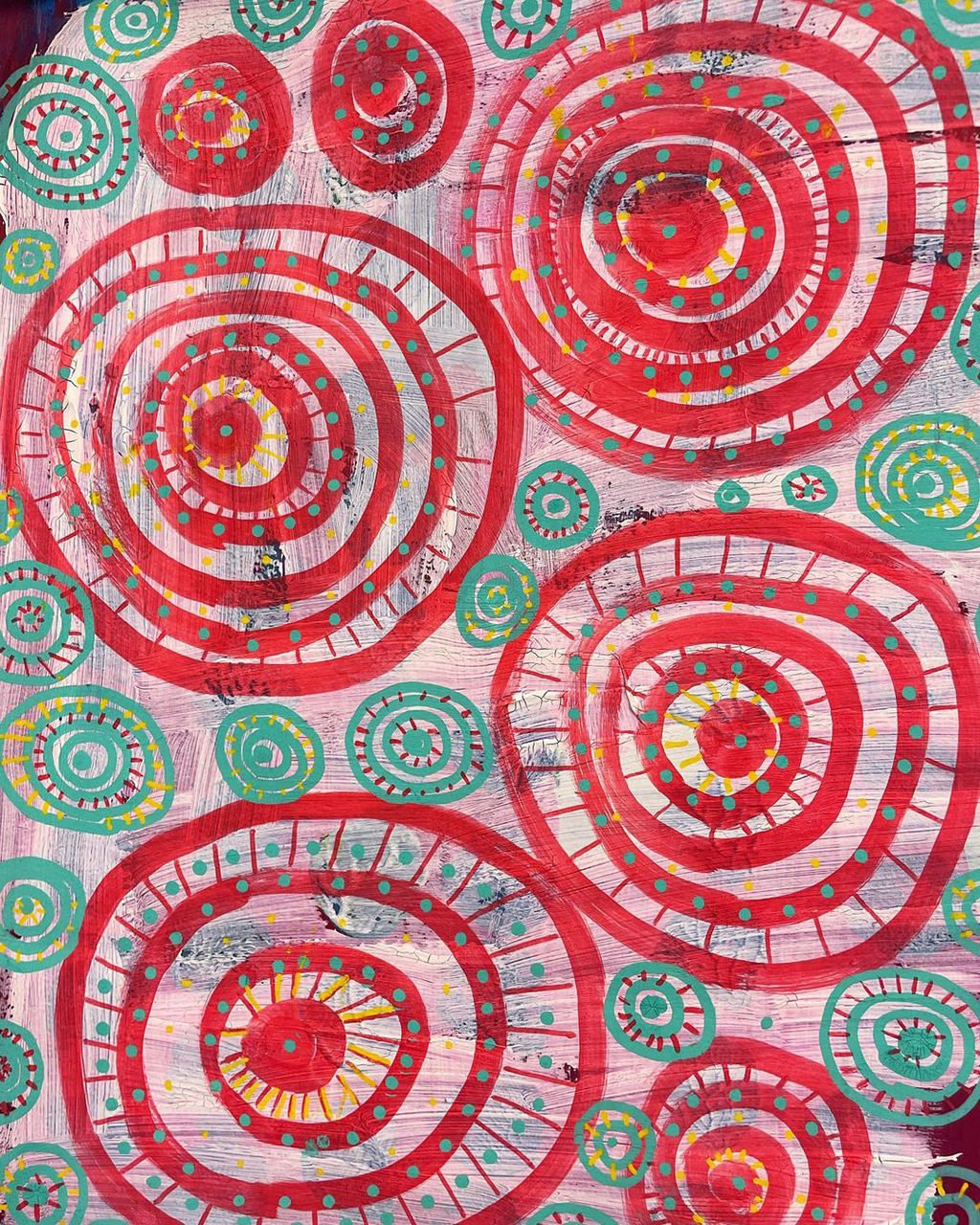 Abstract painting featuring large red concentric circles with teal and yellow dotted patterns, set against a textured, multicolored background.
