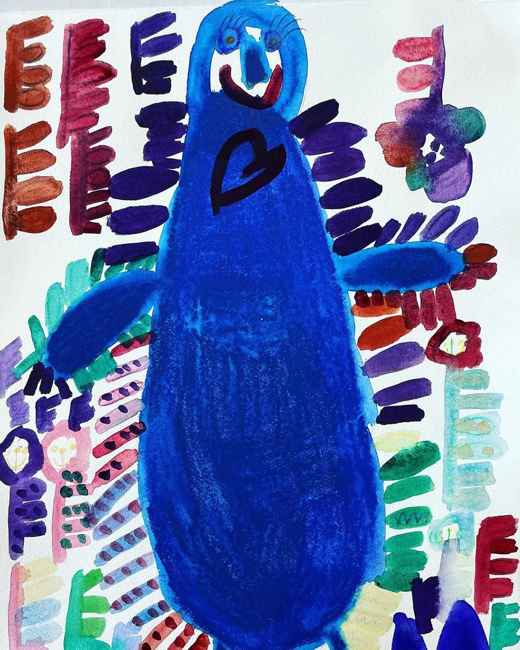 A colorful children's drawing featuring a large, blue creature with a smiling face, big eyes, and a heart on its chest, surrounded by various abstract shapes and patterns in multiple bright colors.
