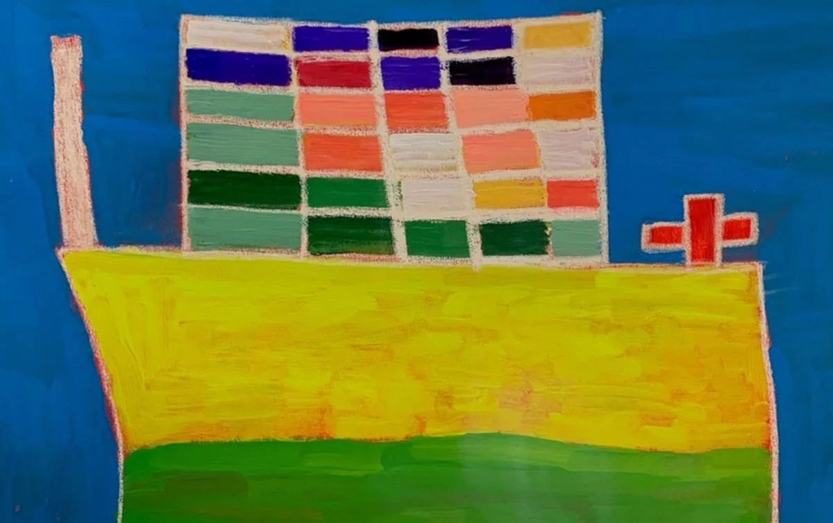 A colorful drawing of a boat with a yellow hull, green bottom, and a red cross on top, with a blue sky background and a panel of colorful squares.