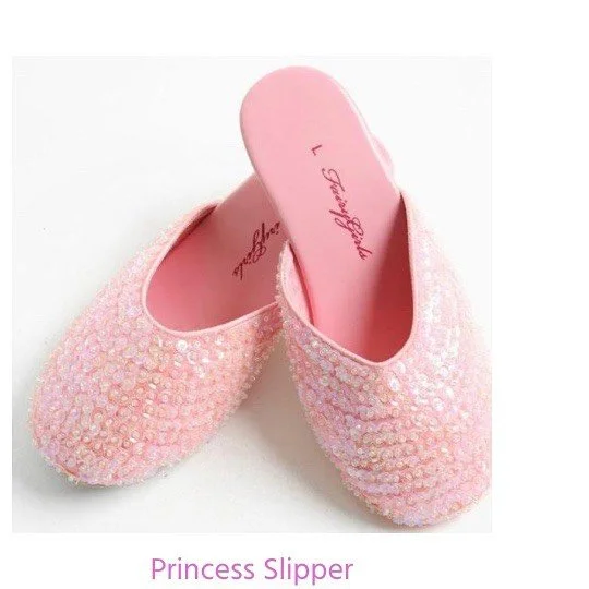 Pink princess slippers decorated with shiny rhinestones, positioned with one slipper upright and the other lying on its side.