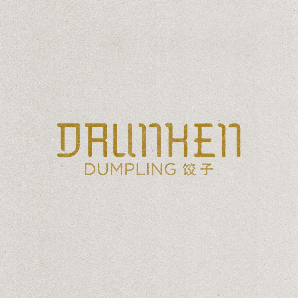 A logo for a dumpling restaurant called 'Drunken Dumpling' with Chinese characters for dumpling.