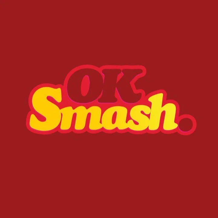 Colorful logo with the text 'OK Smash' in red and yellow on a red background.