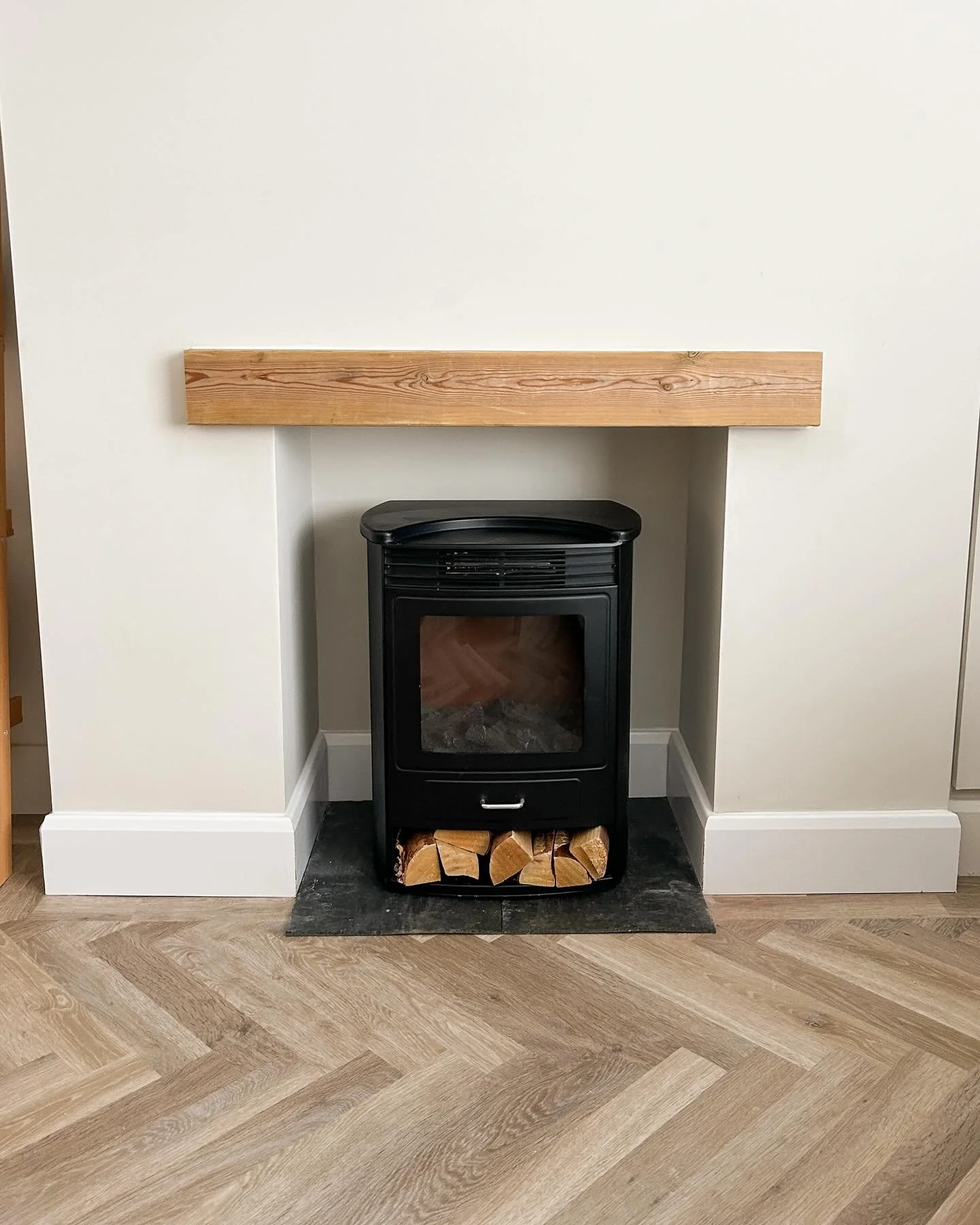 Fire place upgrade for todays job. 
•
Skirting on. Hearth cut and installed & to finish it off a wooden beam mantel installed. 
•
Swipe for before!