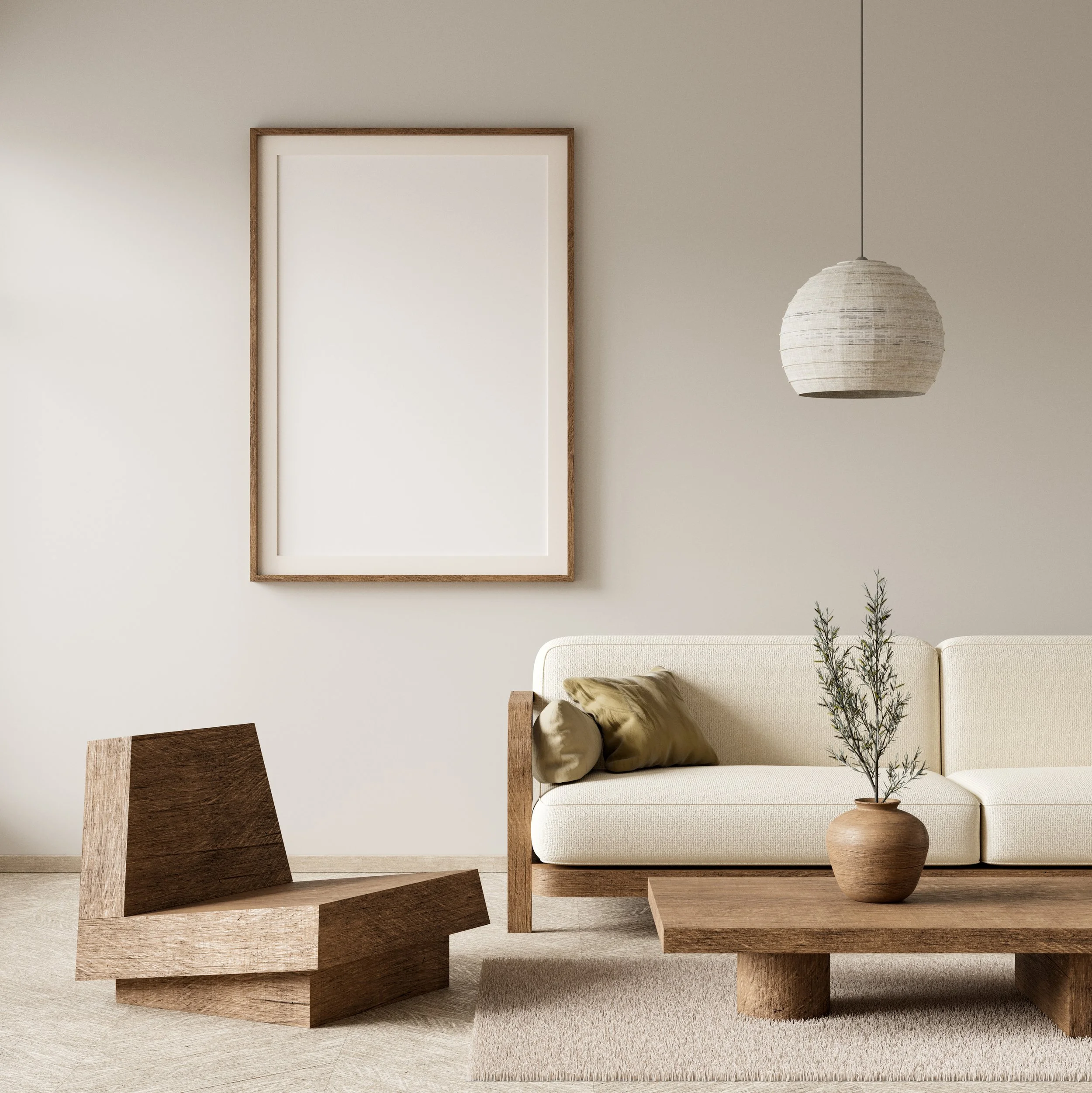 Interioraufnahme eines minimalistischen Wohnzimmers mit weißen Wänden, einem weißen Sofa, einem großen weißen Bilderrahmen an der Wand, einer Stehlampe aus Papier, einer Vase mit Zweigen und mehreren Holztischen.