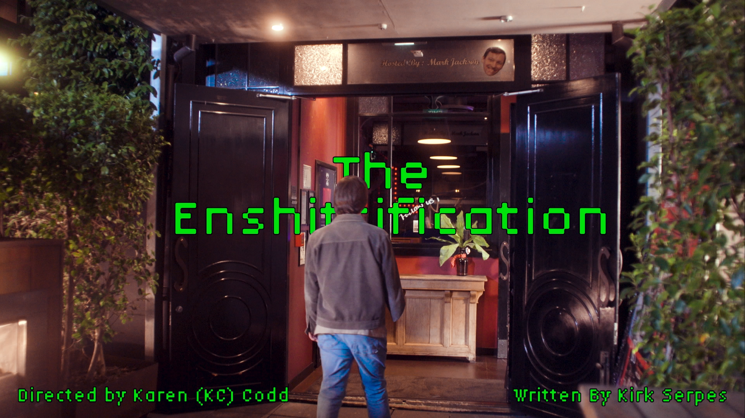 The title card of the movie with the lead character walking upto the bar