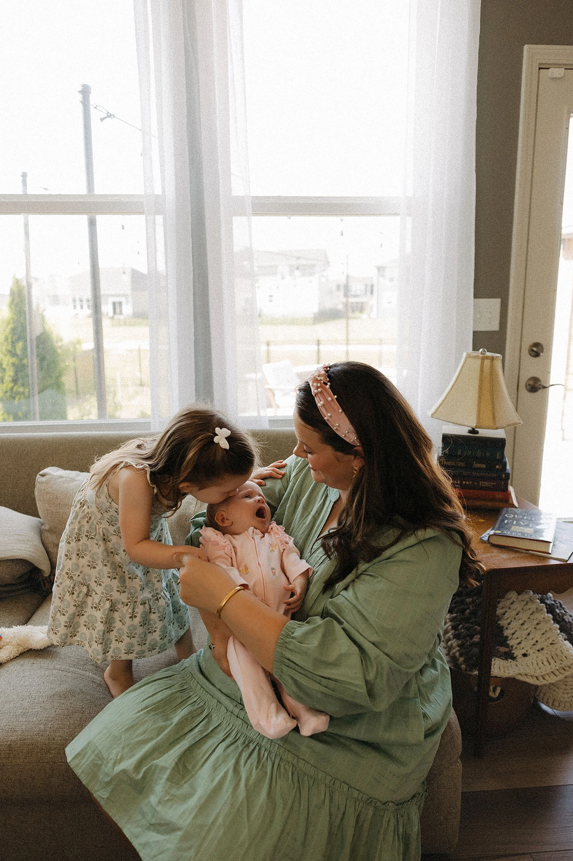  newborn lifestyle photography session in Westfield Indiana living room 