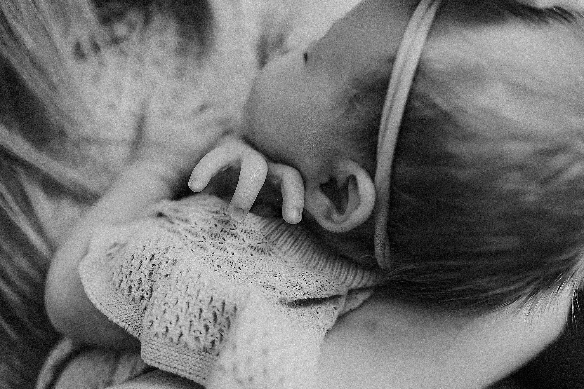 Soft neutral clothing for newborn family photos in natural light