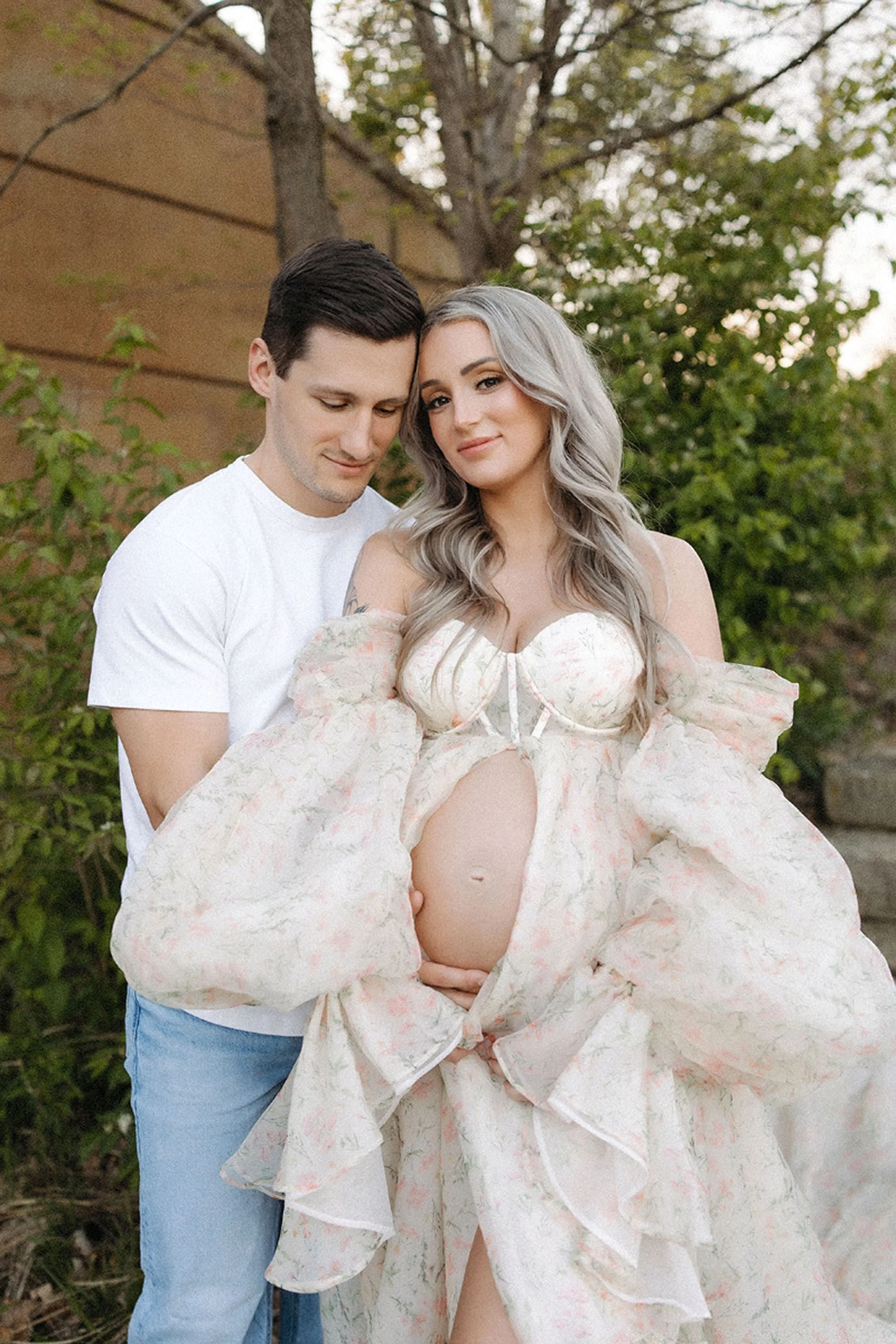 Romantic Maternity Photos in Central Indiana capturing a loving couple celebrating pregnancy in soft natural light and timeless style