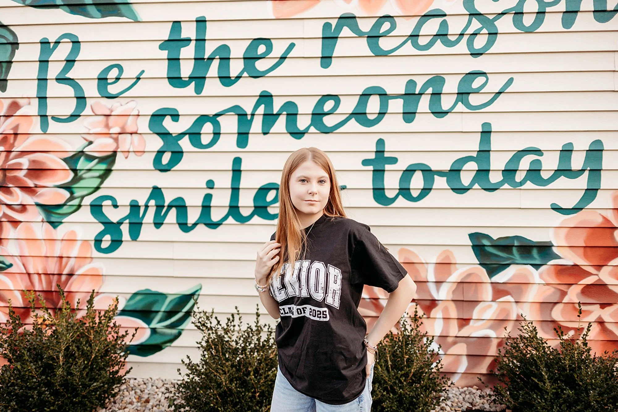 Creative Lebanon senior photos featuring a Class of 2025 high school senior posing in front of a vibrant inspirational mural